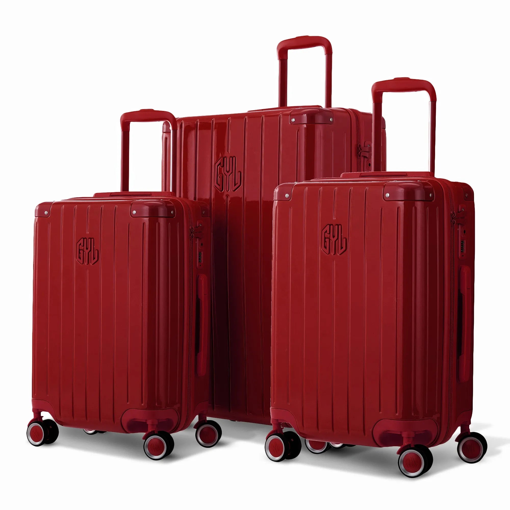 Trio de valises rigides GYL Intemporelle Rouge foncé avec coques nervurées et poignées télescopiques.