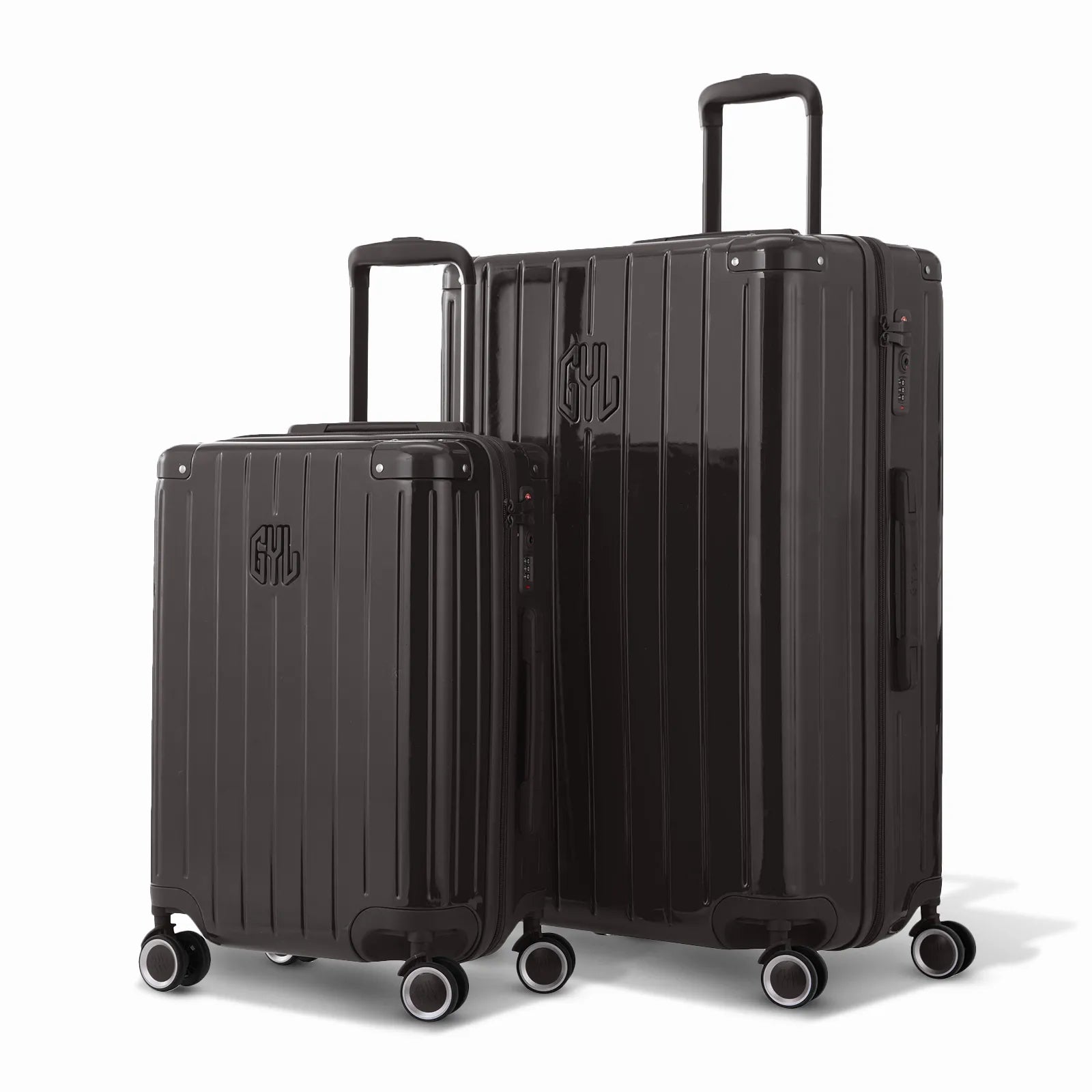 Duo de valises rigides GYL Intemporelle noir avec coques nervurées et poignées télescopiques.