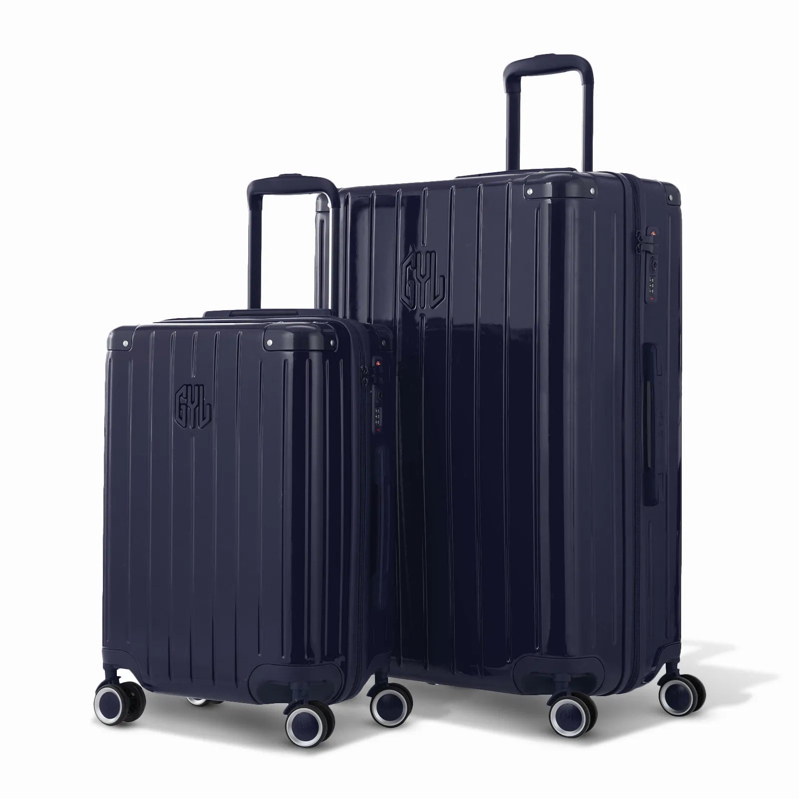 Duo de valises rigides GYL Intemporelle marine avec coques nervurées et poignées télescopiques.