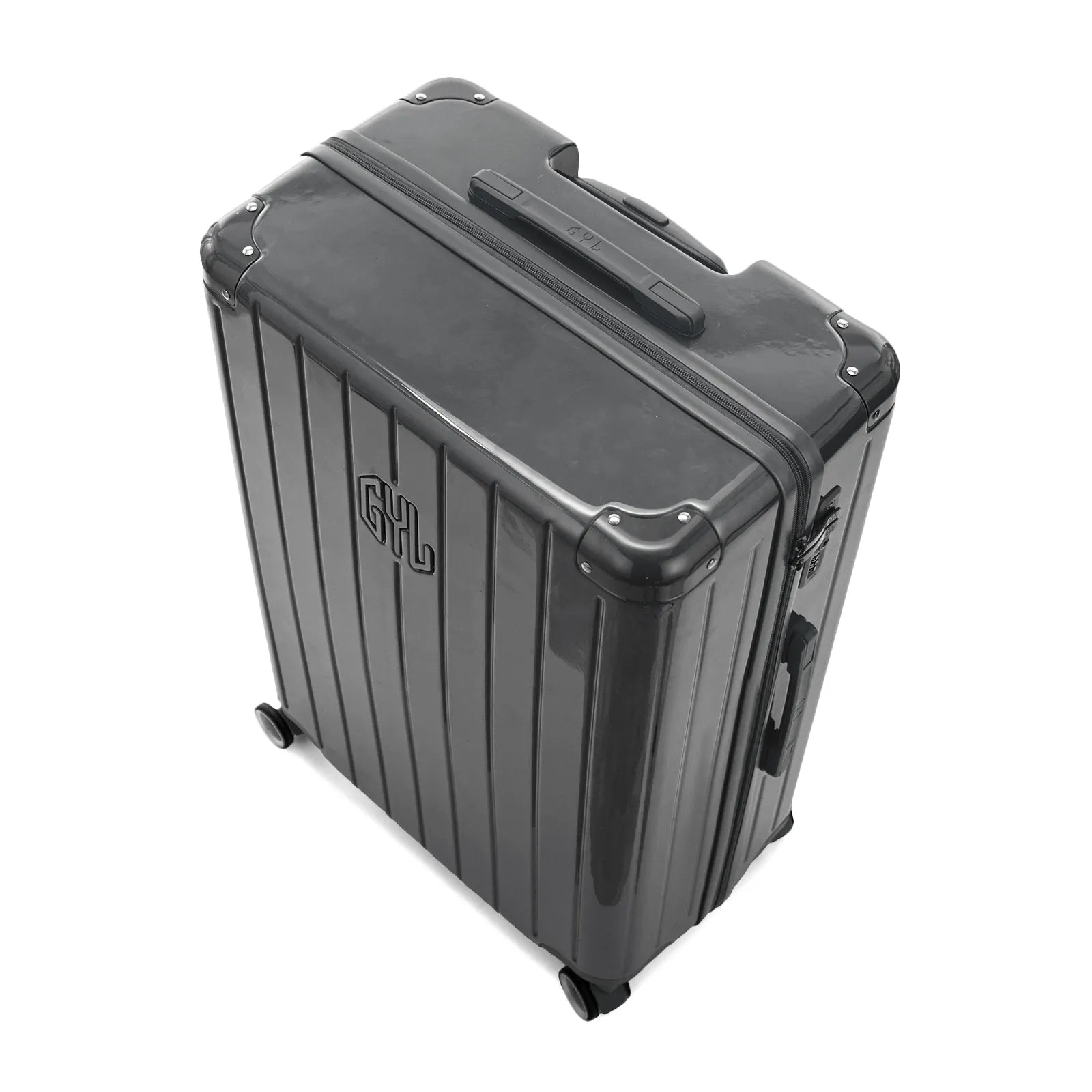 Vue en angle de la valise rigide GYL Intemporelle gris foncé avec coins renforcés et coque nervurée brillante.