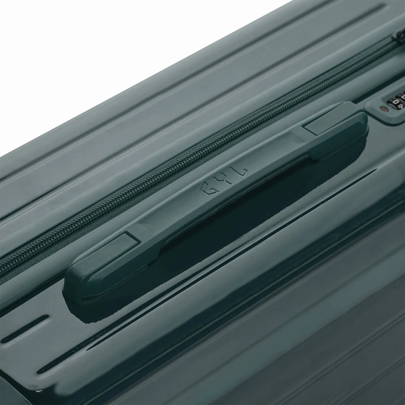 Poignée supérieure rigide de la valise GYL Intemporelle gris foncé avec logo embossé sur le dessus.