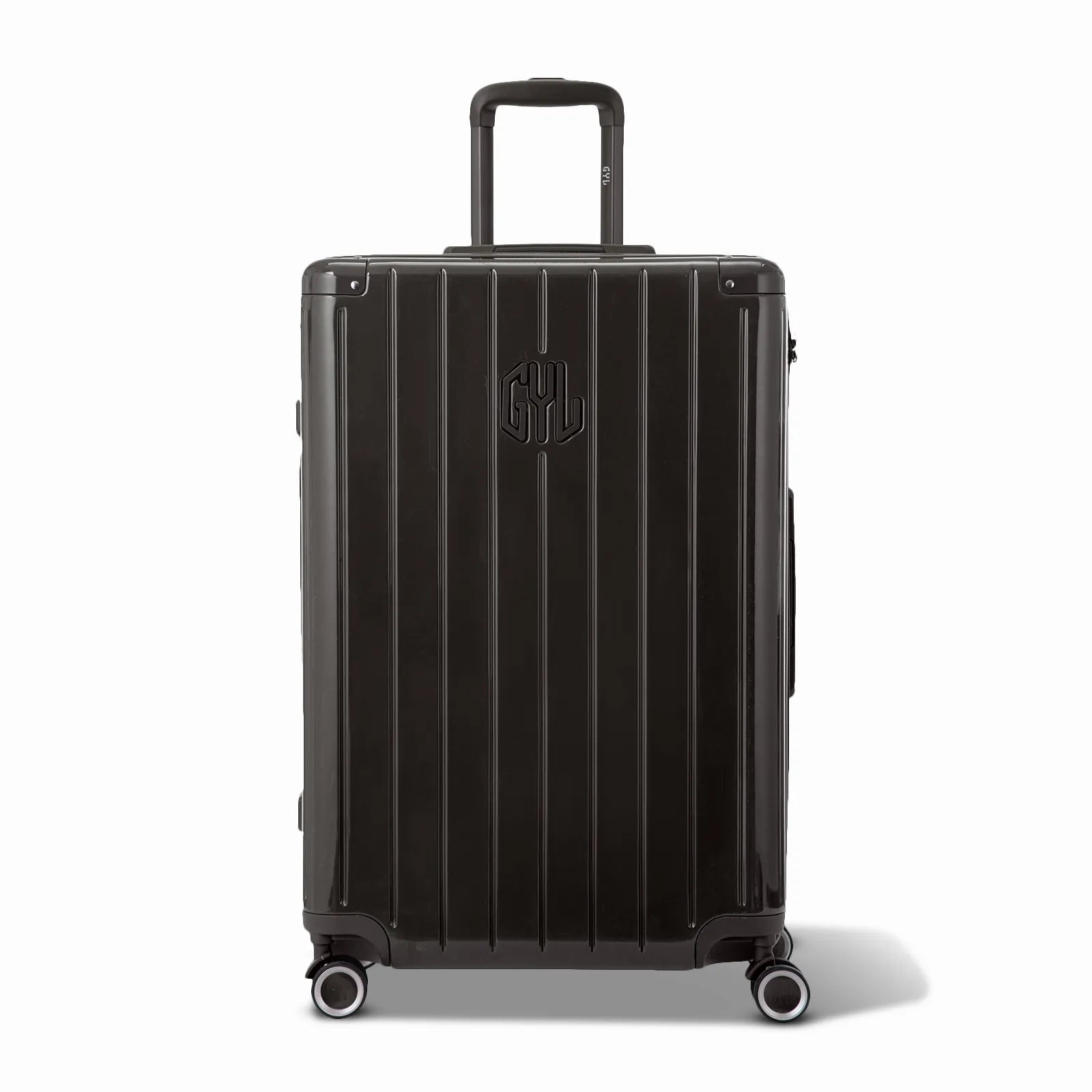 Vue avant de la valise rigide GYL Intemporelle noir, logo embossé et roulettes 360 degrés.