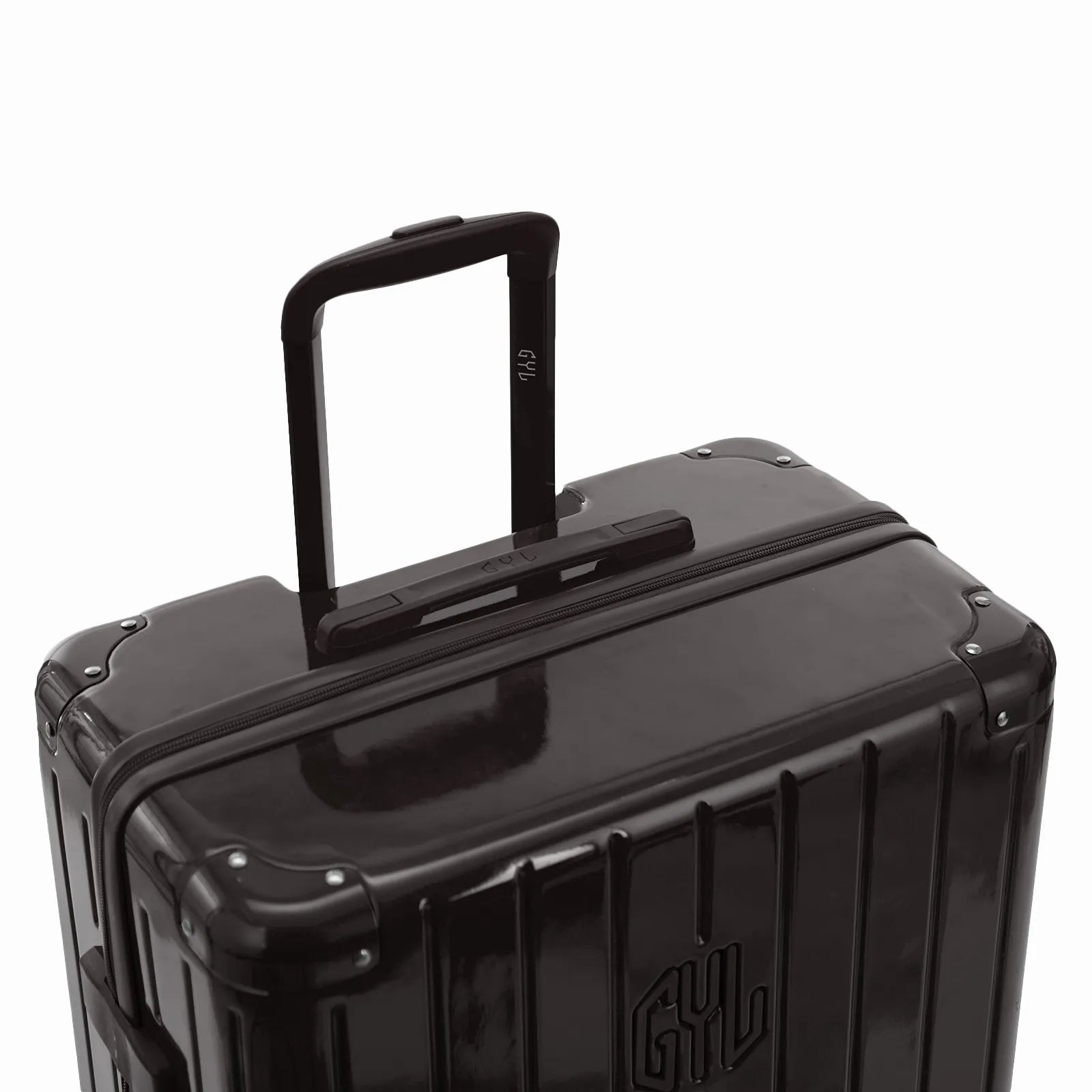 Poignée trolley télescopique GYL déployée sur la valise Intemporelle noir en polycarbonate.