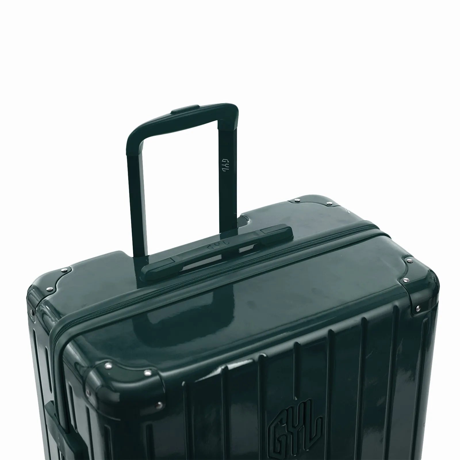 Poignée trolley télescopique GYL déployée sur la valise Intemporelle gris foncé en polycarbonate.