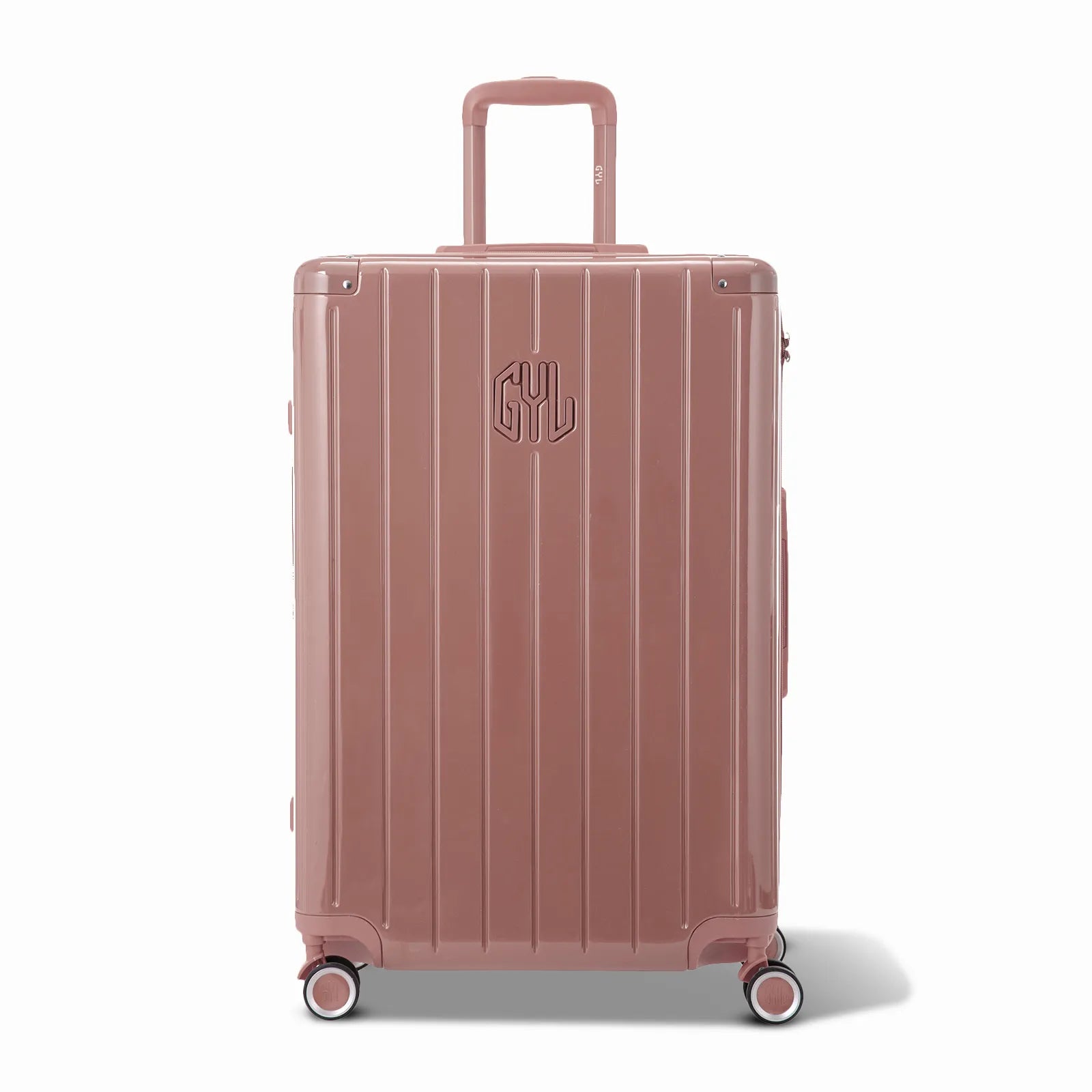 Vue avant de la valise rigide GYL Intemporelle rose gold, logo embossé et roulettes 360 degrés.