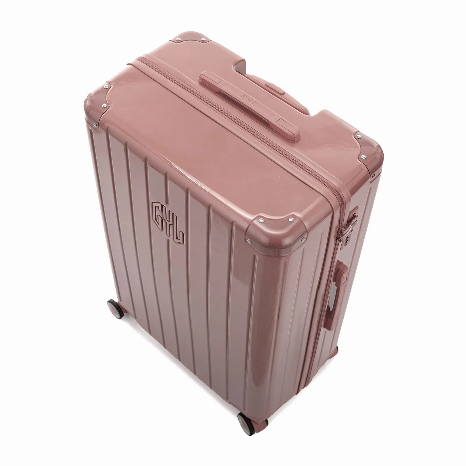 Vue en angle de la valise rigide GYL Intemporelle rose gold avec coins renforcés et coque nervurée brillante.