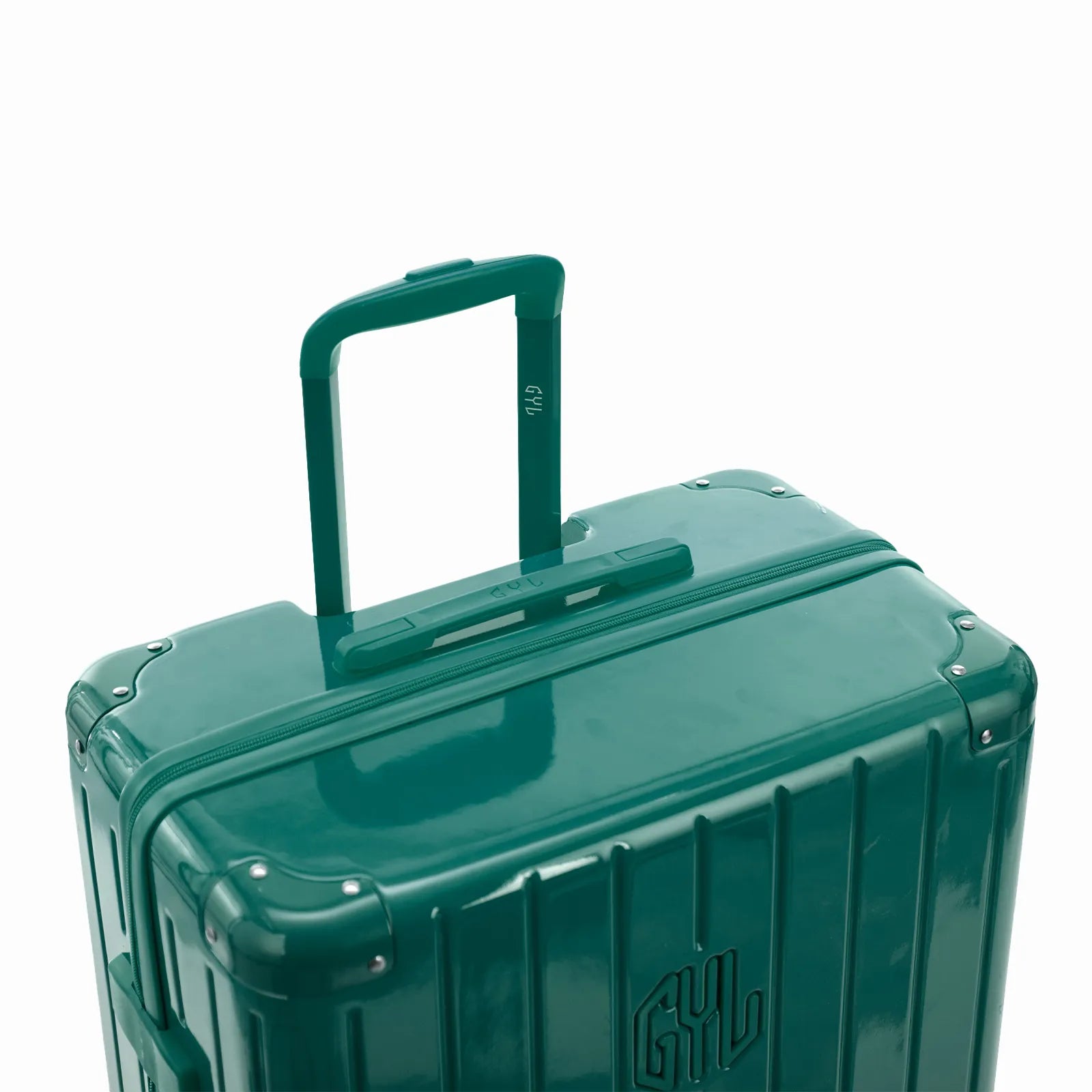 Poignée trolley télescopique GYL déployée sur la valise Intemporelle vert d'eau en polycarbonate.