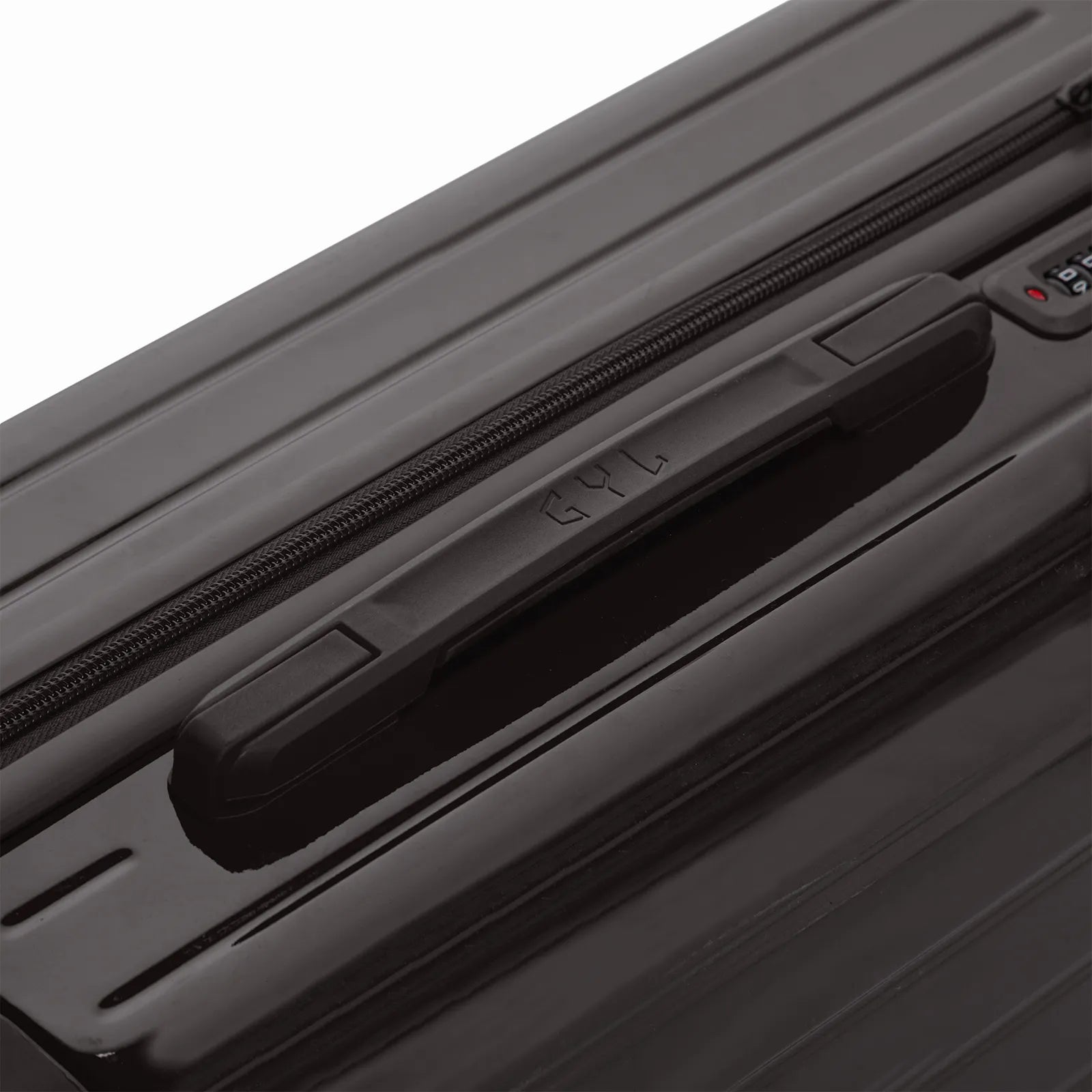 Poignée supérieure rigide de la valise GYL Intemporelle noir avec logo embossé sur le dessus.