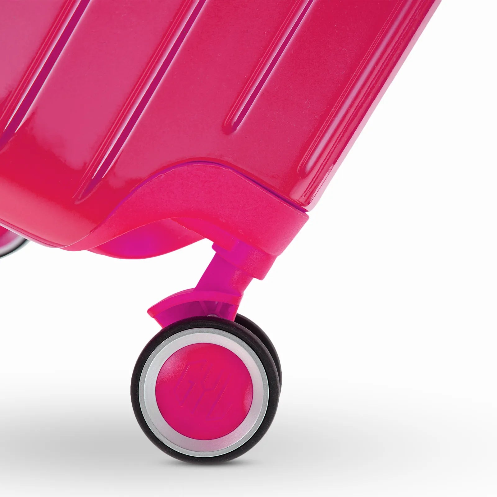 Roue double 360° de la valise GYL Intemporelle fuchsia avec gravure du logo GYL sur le moyeu.