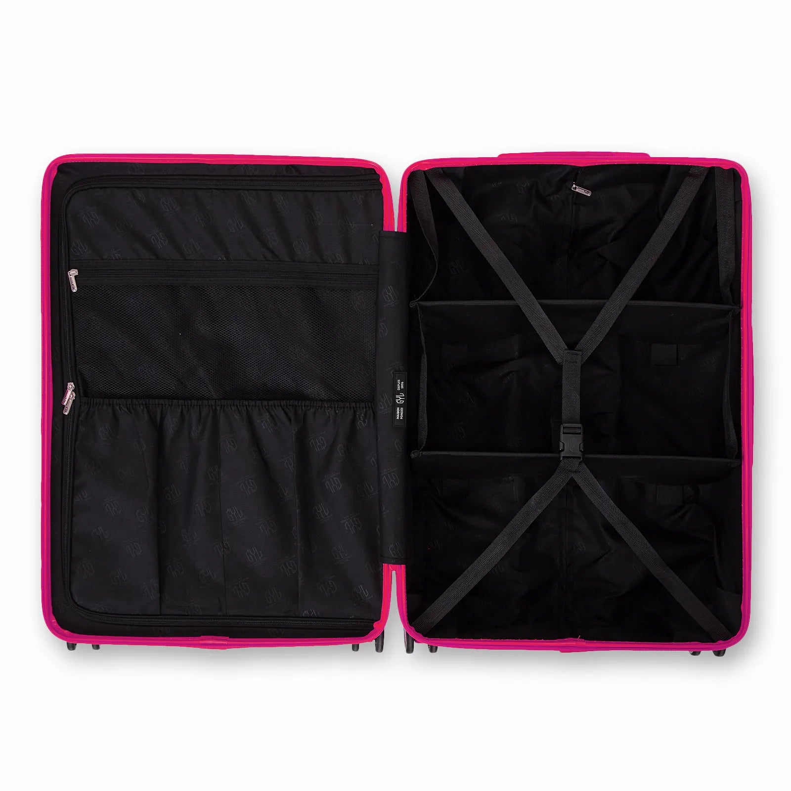 Intérieur compartimenté de la valise GYL Intemporelle fuchsia avec sangles croisées et poches filet.