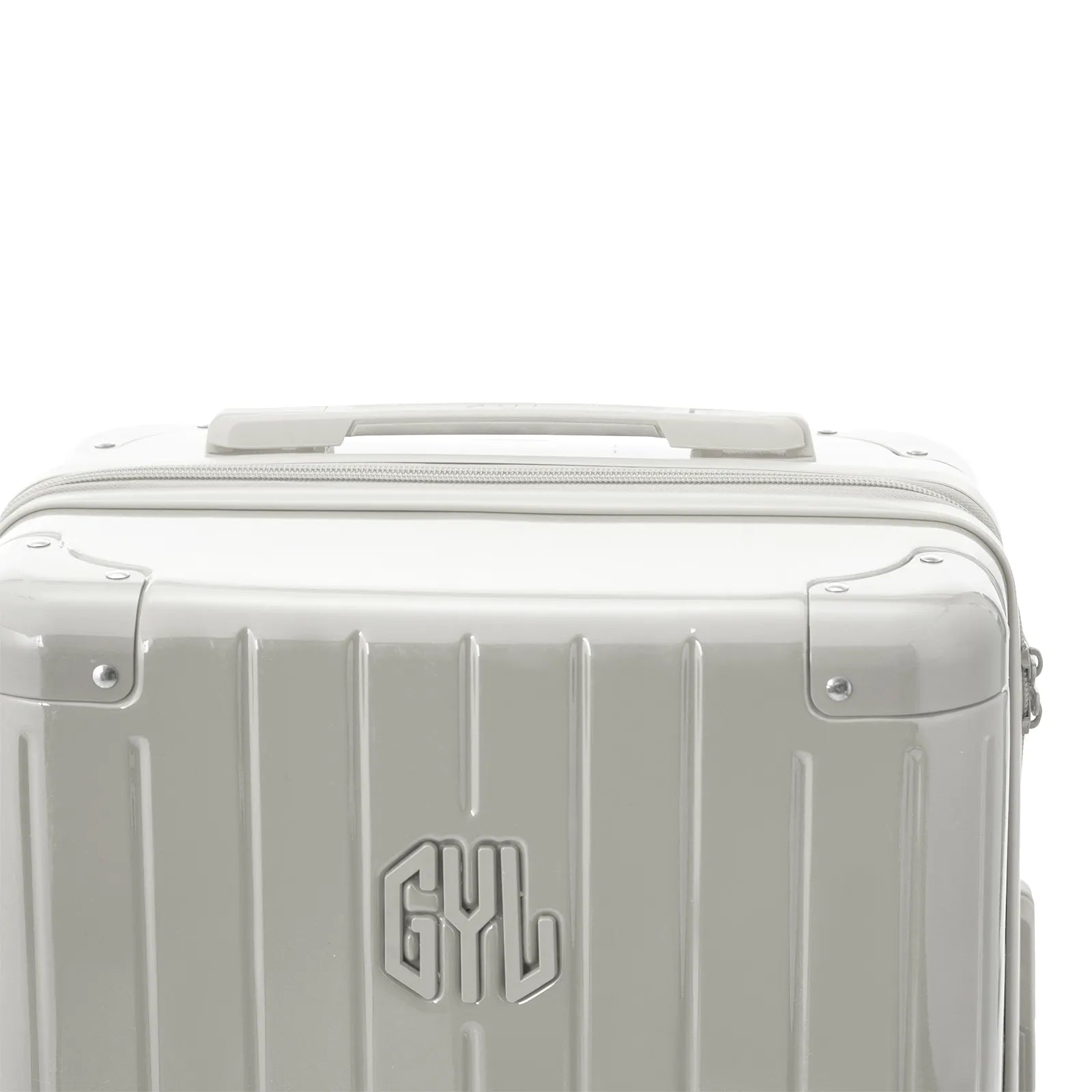 Poignée supérieure rigide de la valise GYL Intemporelle sable avec logo embossé sur le dessus.