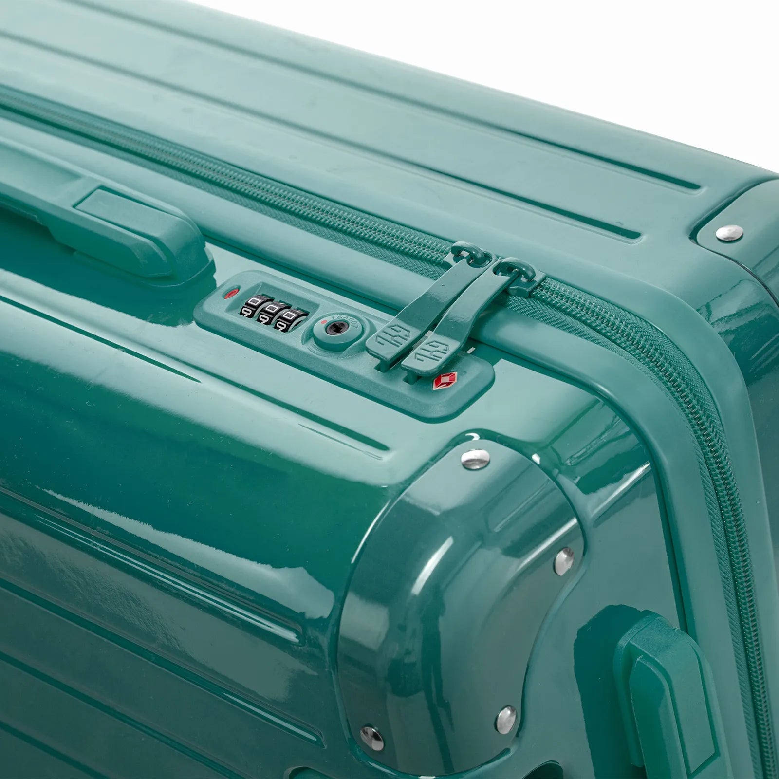 Fermeture à combinaison TSA et double curseur zippé GYL sur la valise rigide vert d'eau Intemporelle.