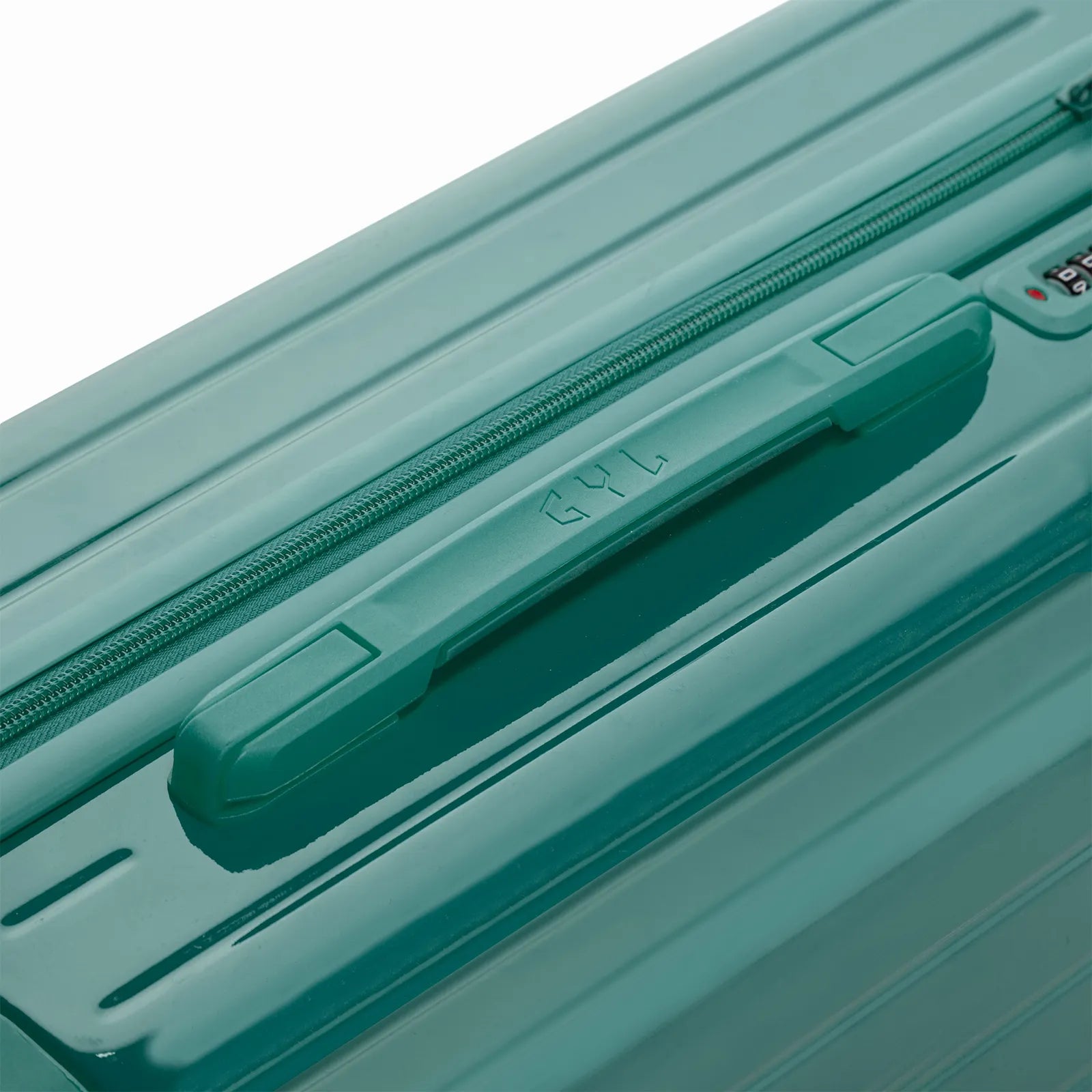 Poignée supérieure rigide de la valise GYL Intemporelle vert d'eau avec logo embossé sur le dessus.