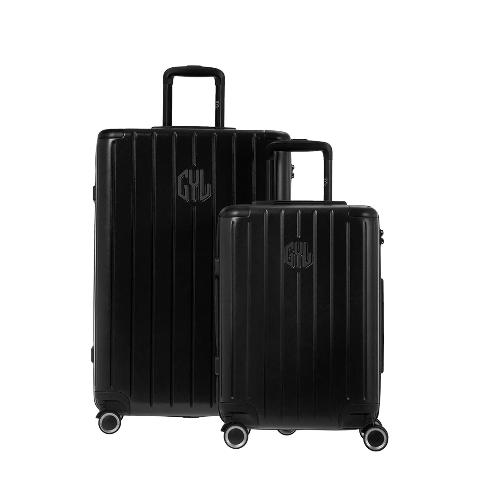Deux valises rigides GYL Intemporelle noir, 2 formats, avec poignée trolley déployée.