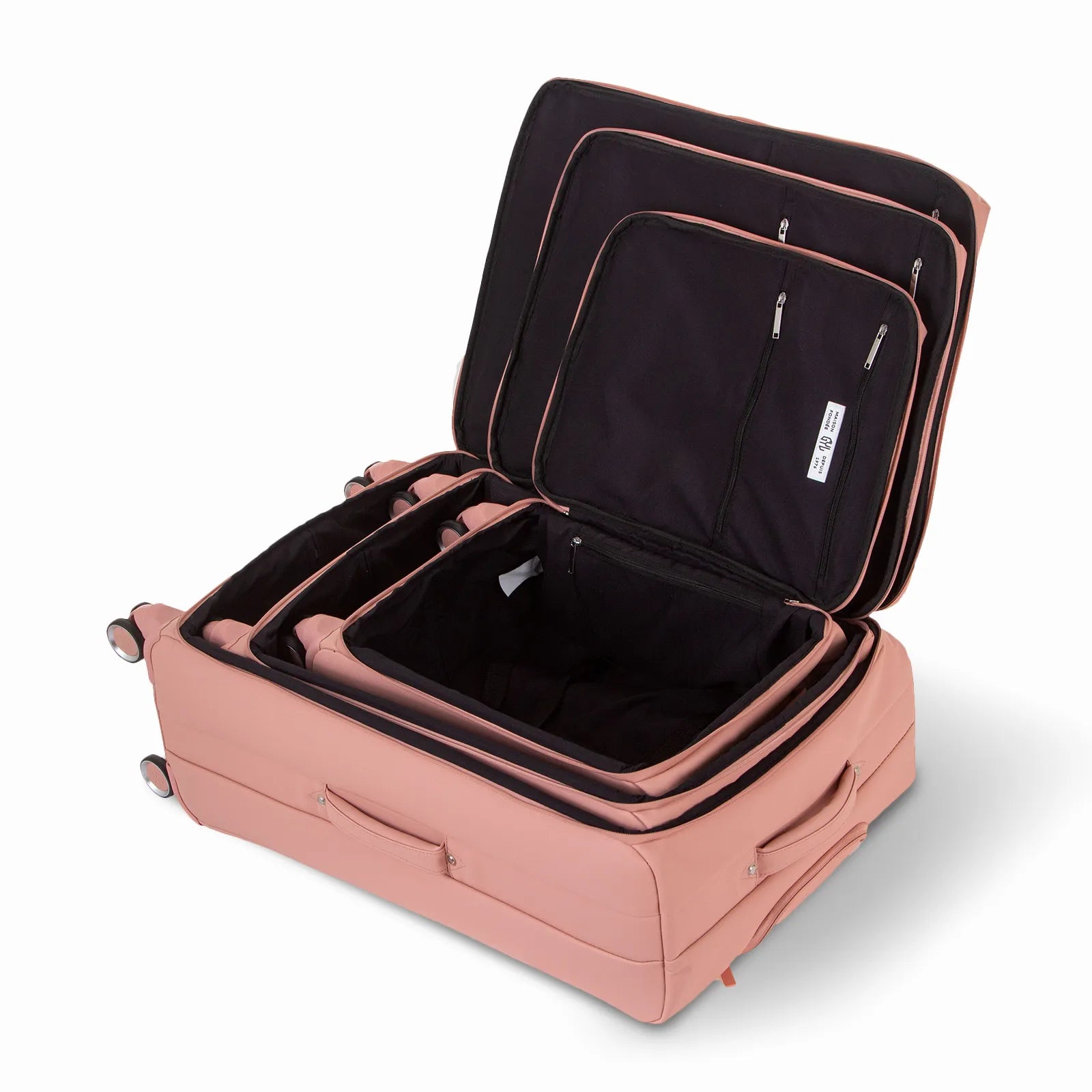 Ensemble de trois valises GYL Évasion en polyuréthane rose gold, ouvertes et imbriquées les unes dans les autres pour montrer leur conception pratique et leur intérieur spacieux.