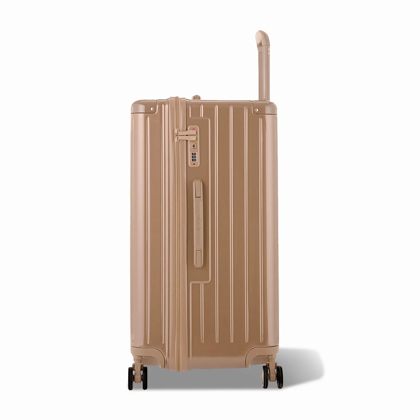 Côté de la valise trunk GYL L champagne avec serrure TSA intégrée et poignée latérale assortie.
