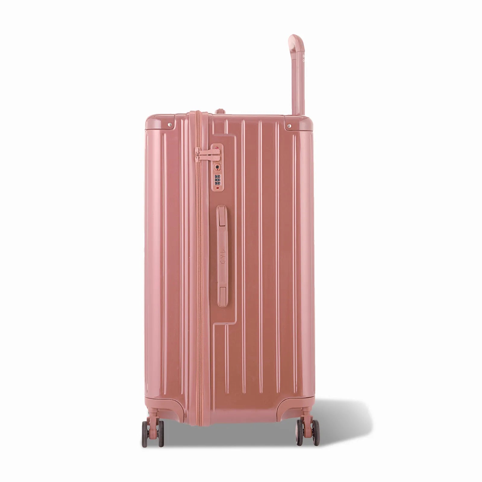 Côté de la valise trunk GYL L rose gold avec serrure TSA intégrée et poignée latérale assortie.