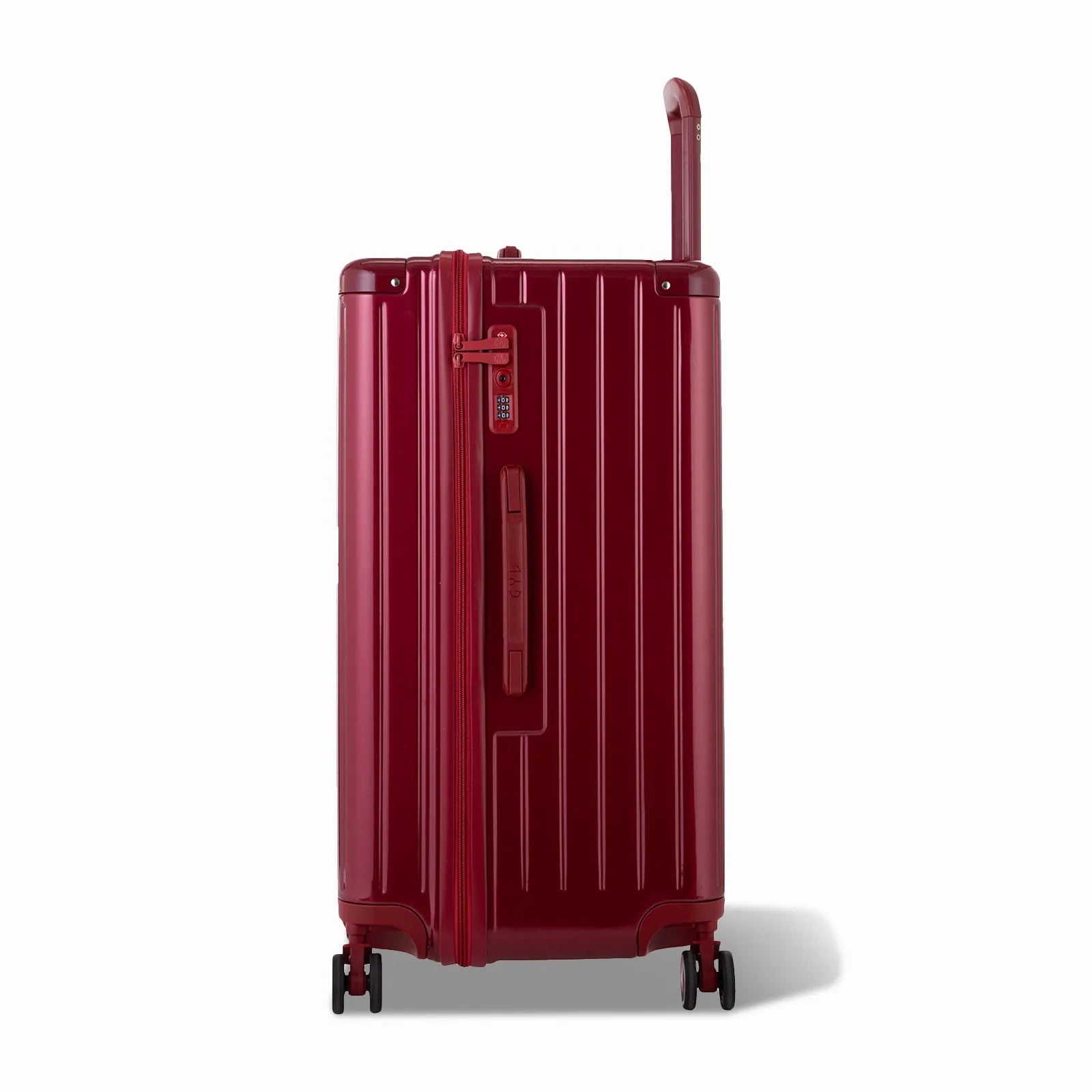 Côté de la valise trunk GYL L rouge foncé avec serrure TSA intégrée et poignée latérale assortie.