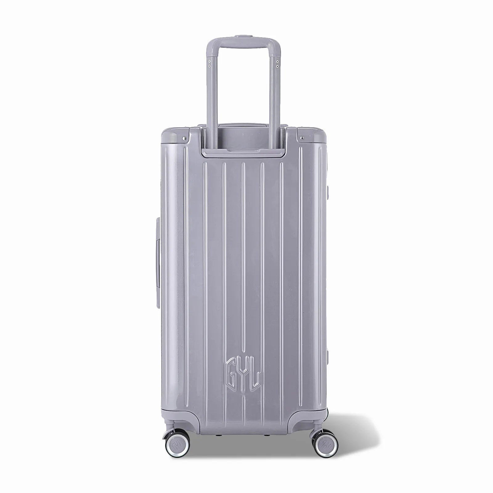 Dos de la valise trunk GYL L argent avec trolley télescopique sorti et logo embossé.
