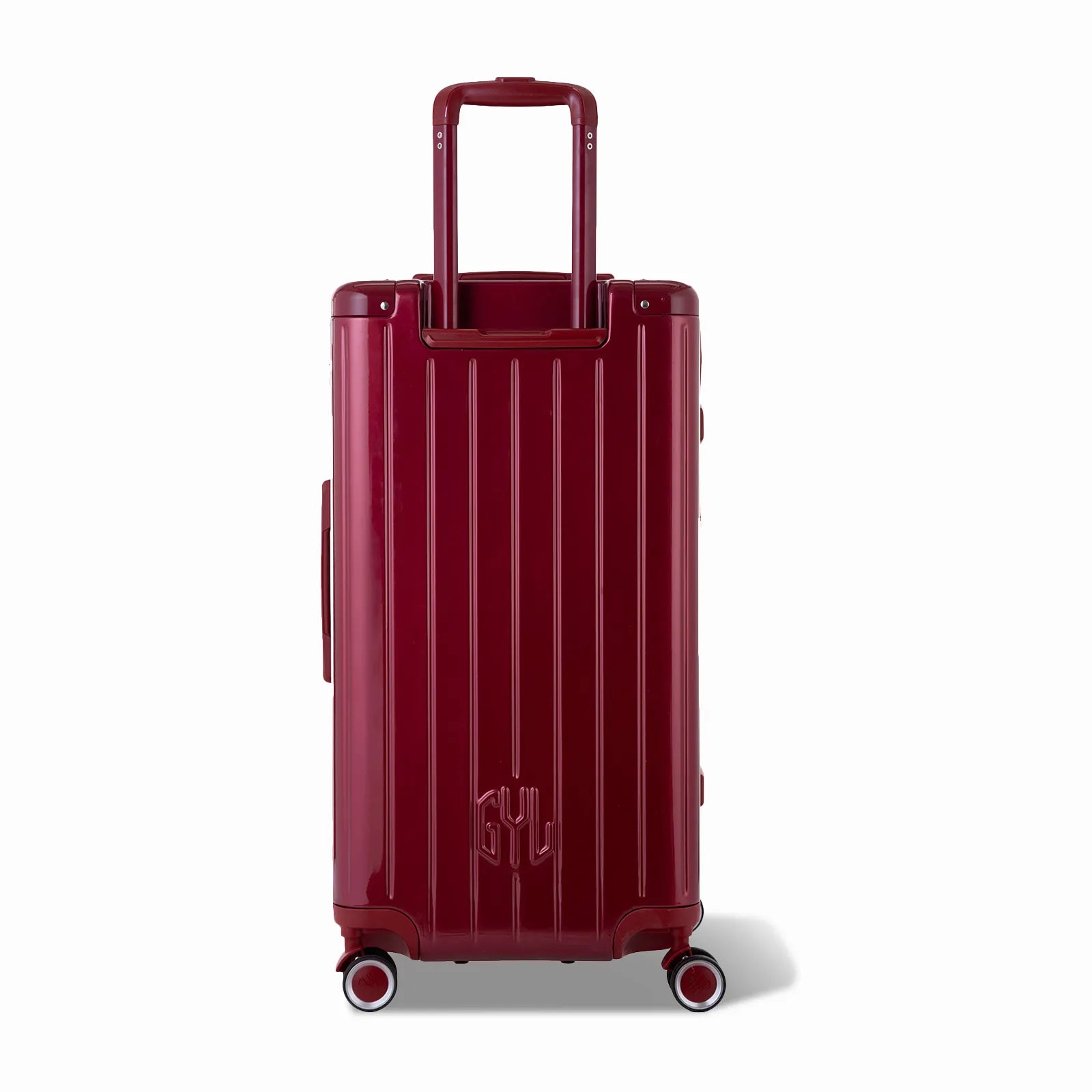 Dos de la valise trunk GYL L rouge foncé avec trolley télescopique sorti et logo embossé.