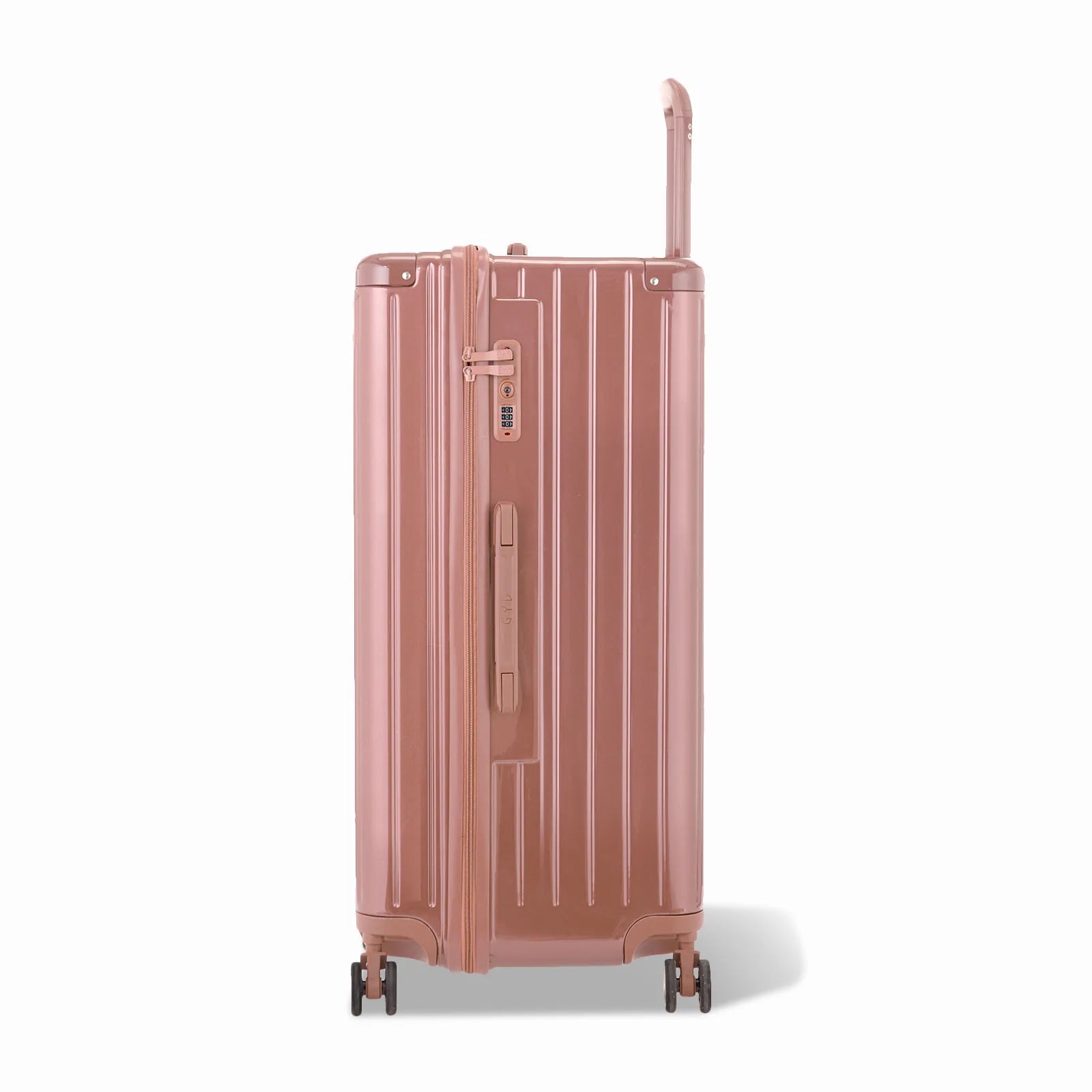 Côté de la valise trunk GYL XL rose gold avec serrure TSA intégrée et poignée latérale assortie.