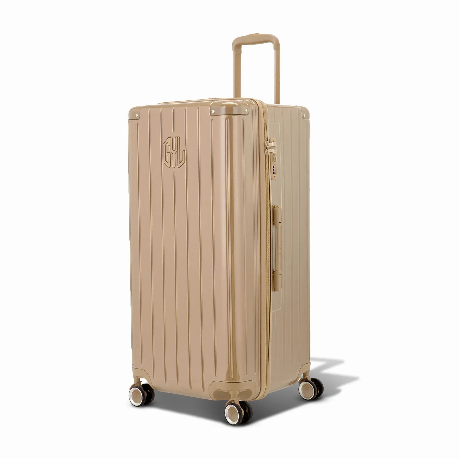 Valise trunk GYL taille XL en polycarbonate champagne vue de trois quarts, avec trolley déployé et roues 360°.