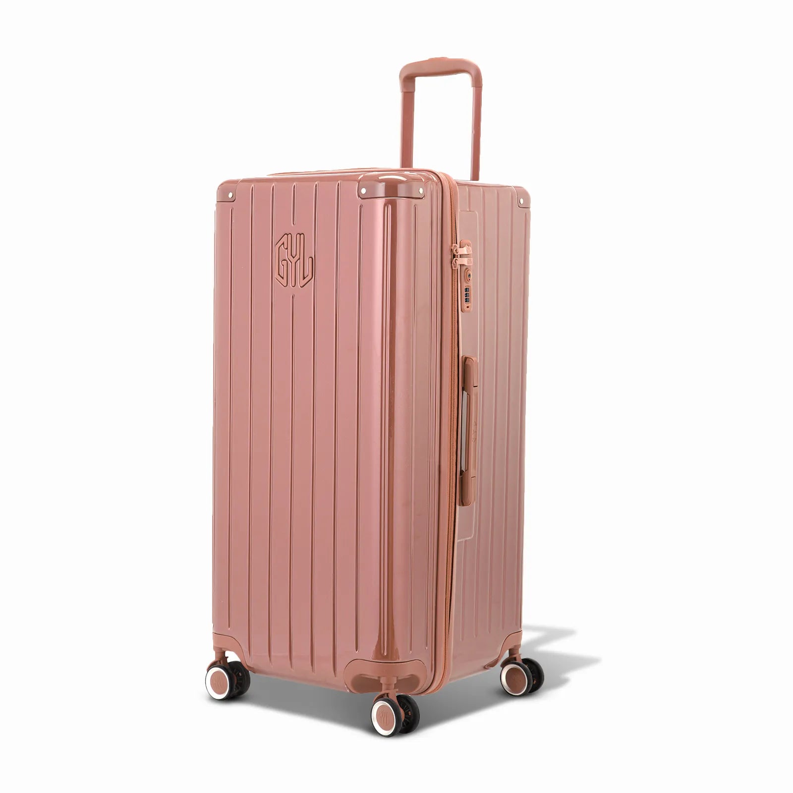 Valise trunk GYL taille XL en polycarbonate rose gold vue de trois quarts, avec trolley déployé et roues 360°.