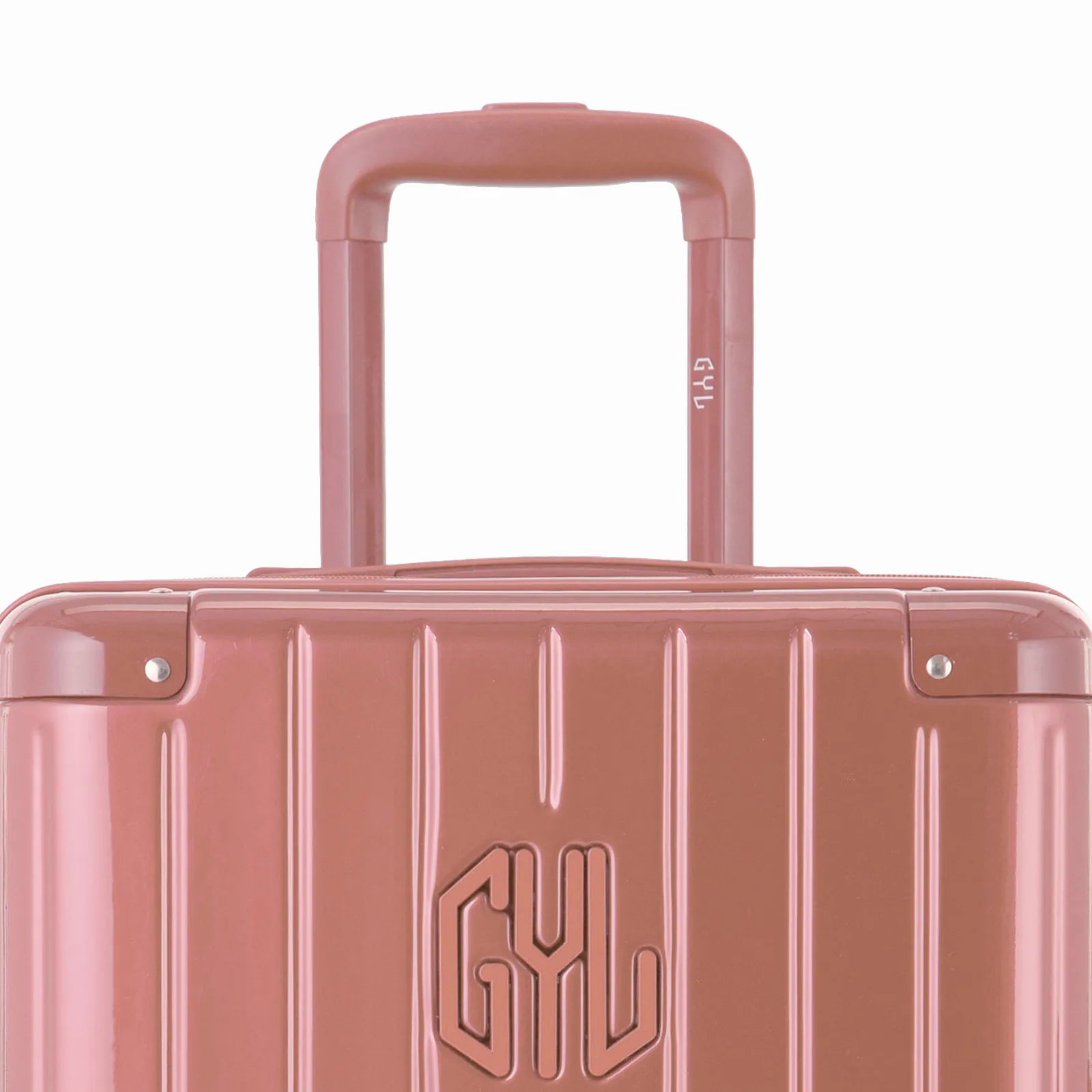 Zoom sur la poignée trolley et le logo GYL de la valise trunk rose gold.