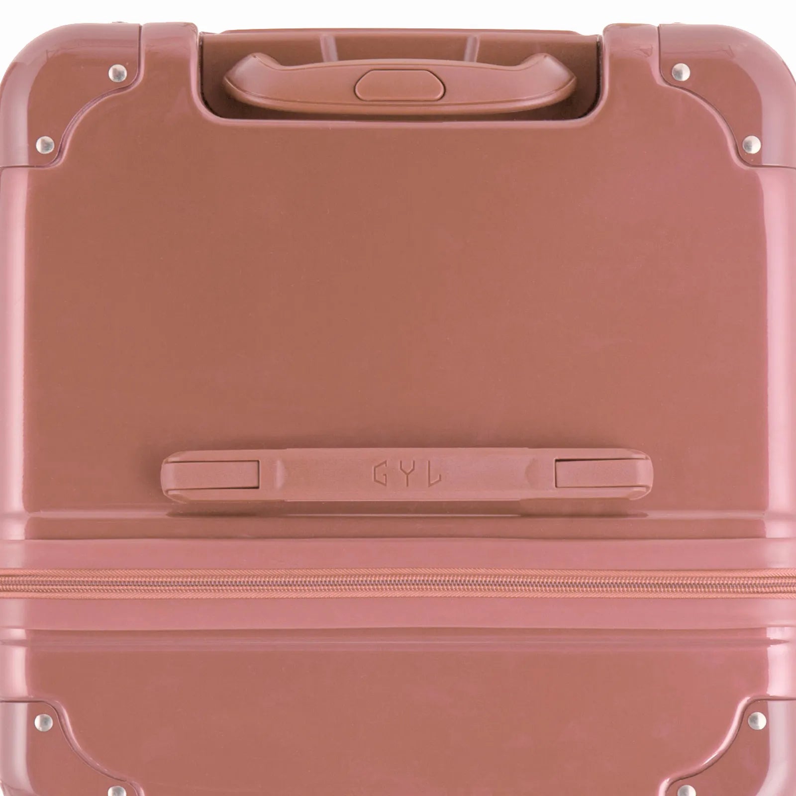 Vue du dessus de la valise trunk GYL rose gold en polycarbonate, avec poignée centrale et coins renforcés.