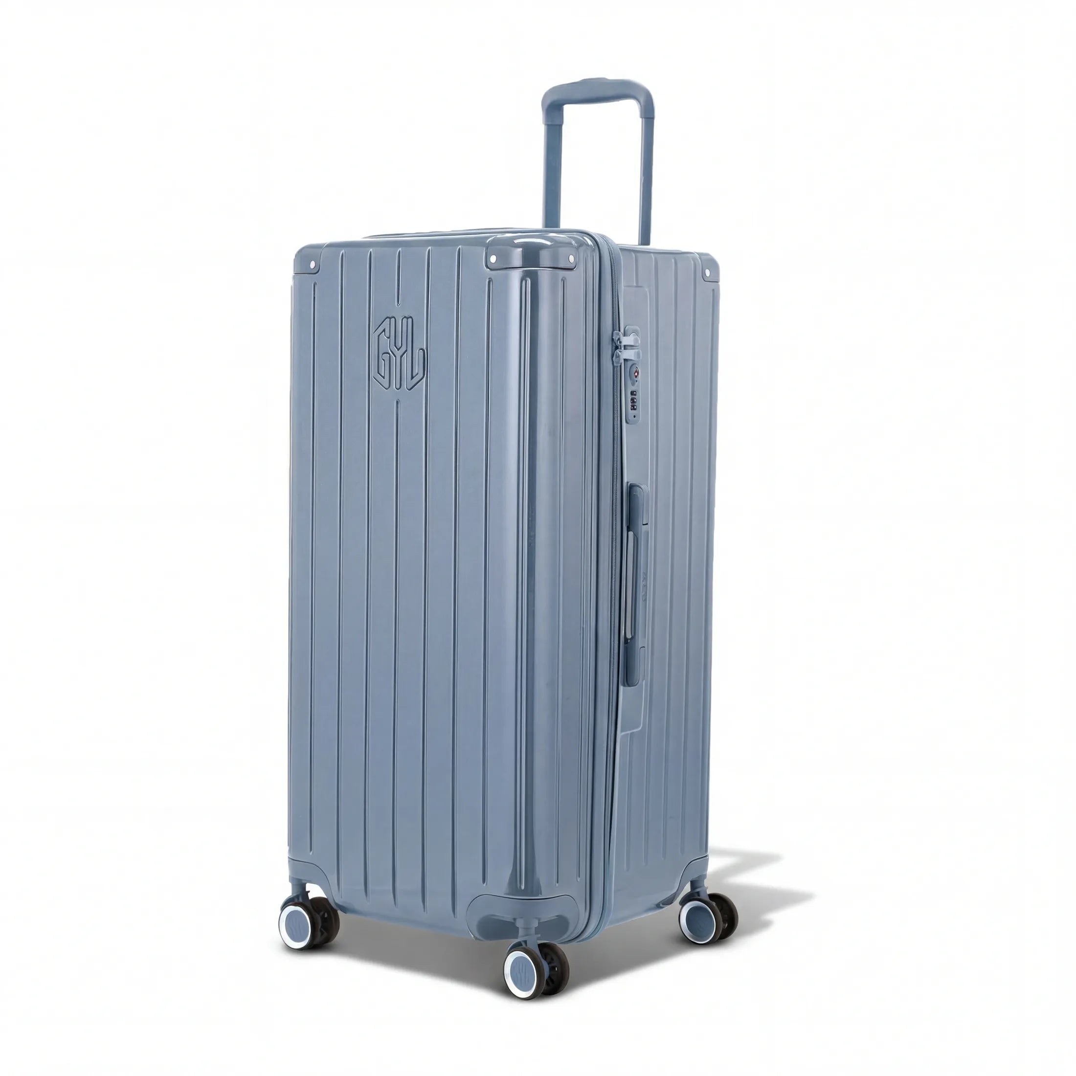 Valise trunk GYL taille XL en polycarbonate bleu gris vue de trois quarts, avec trolley déployé et roues 360°.