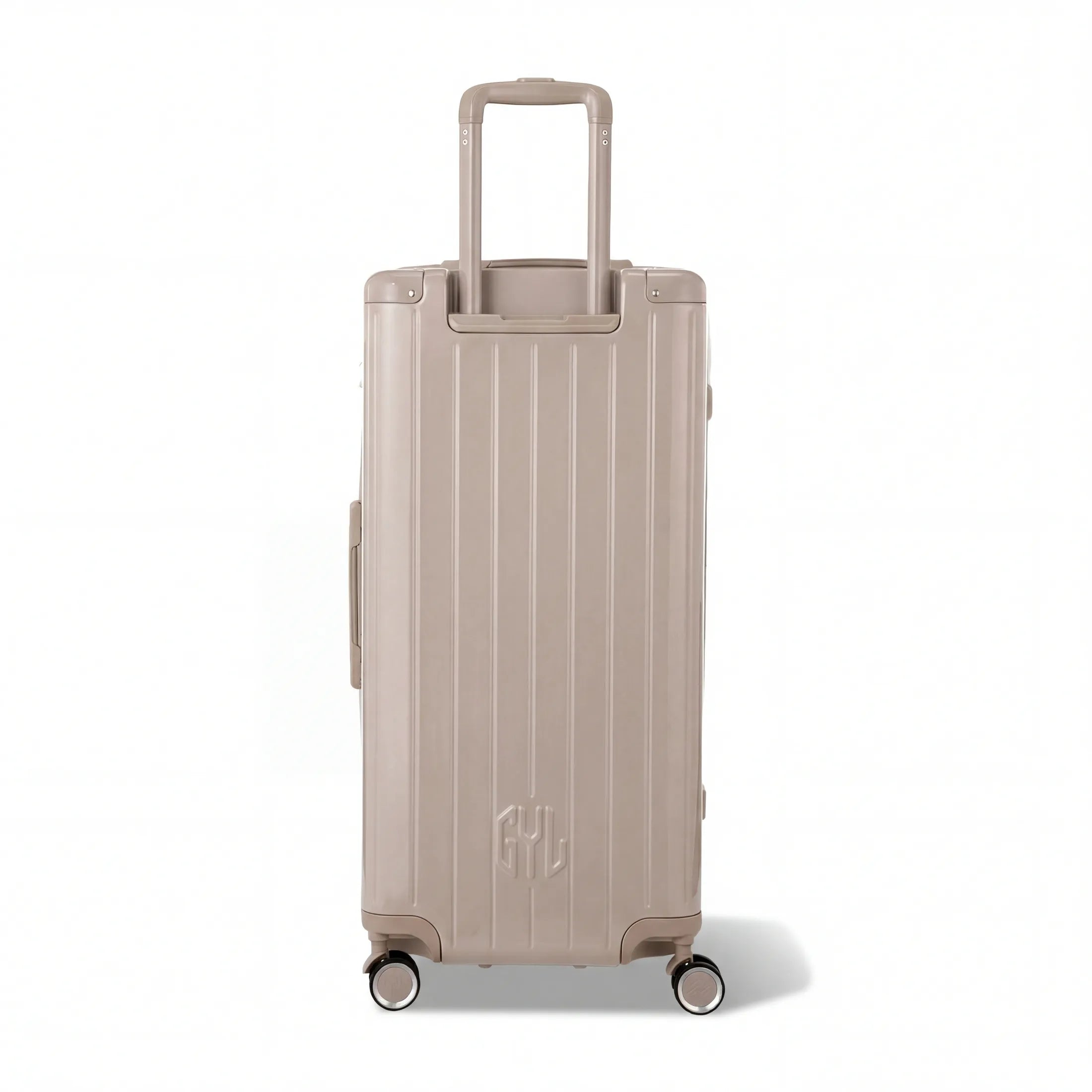 Dos de la valise trunk GYL XL nude avec trolley télescopique sorti et logo embossé.