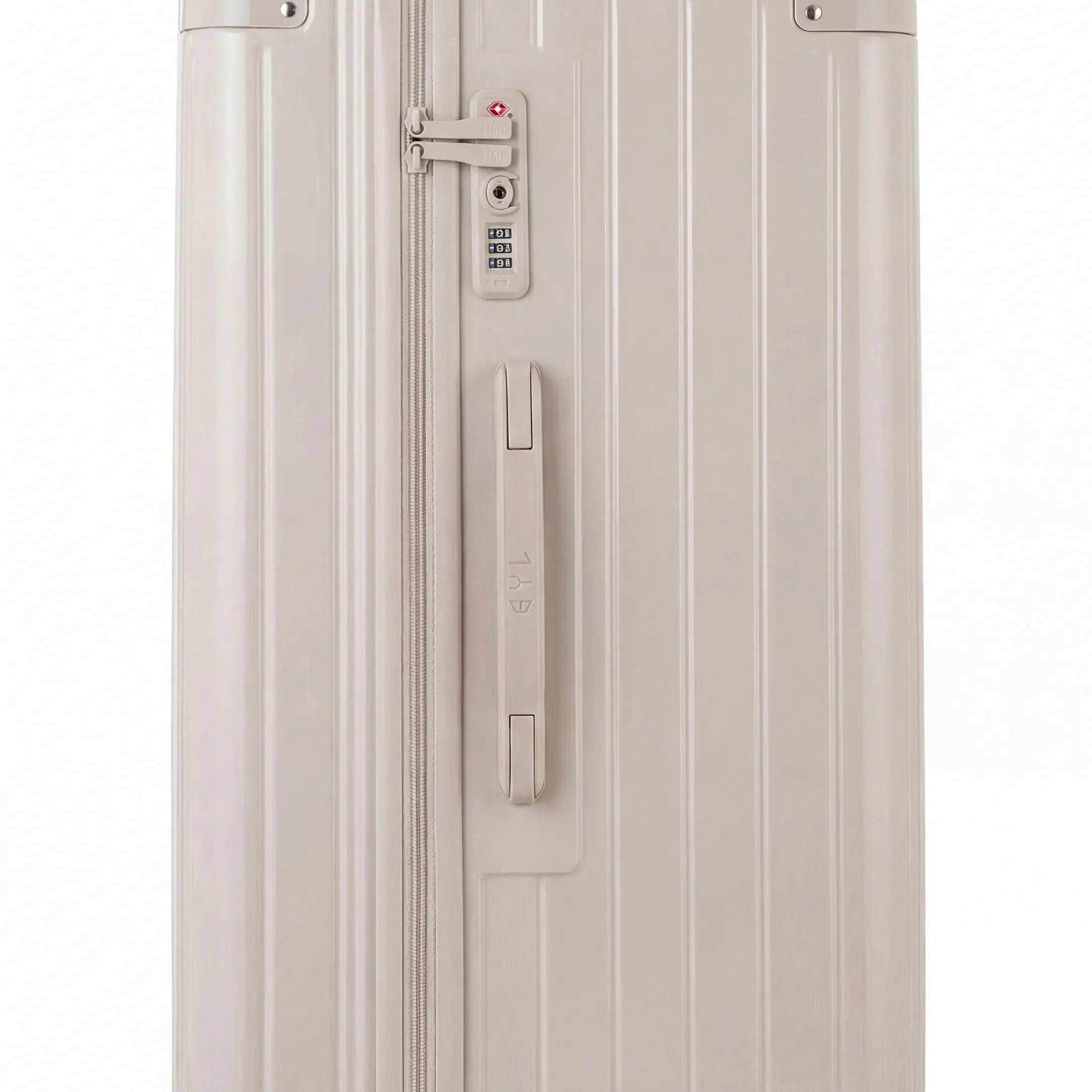 Détail de la serrure TSA et de la poignée latérale sur la valise trunk nude.