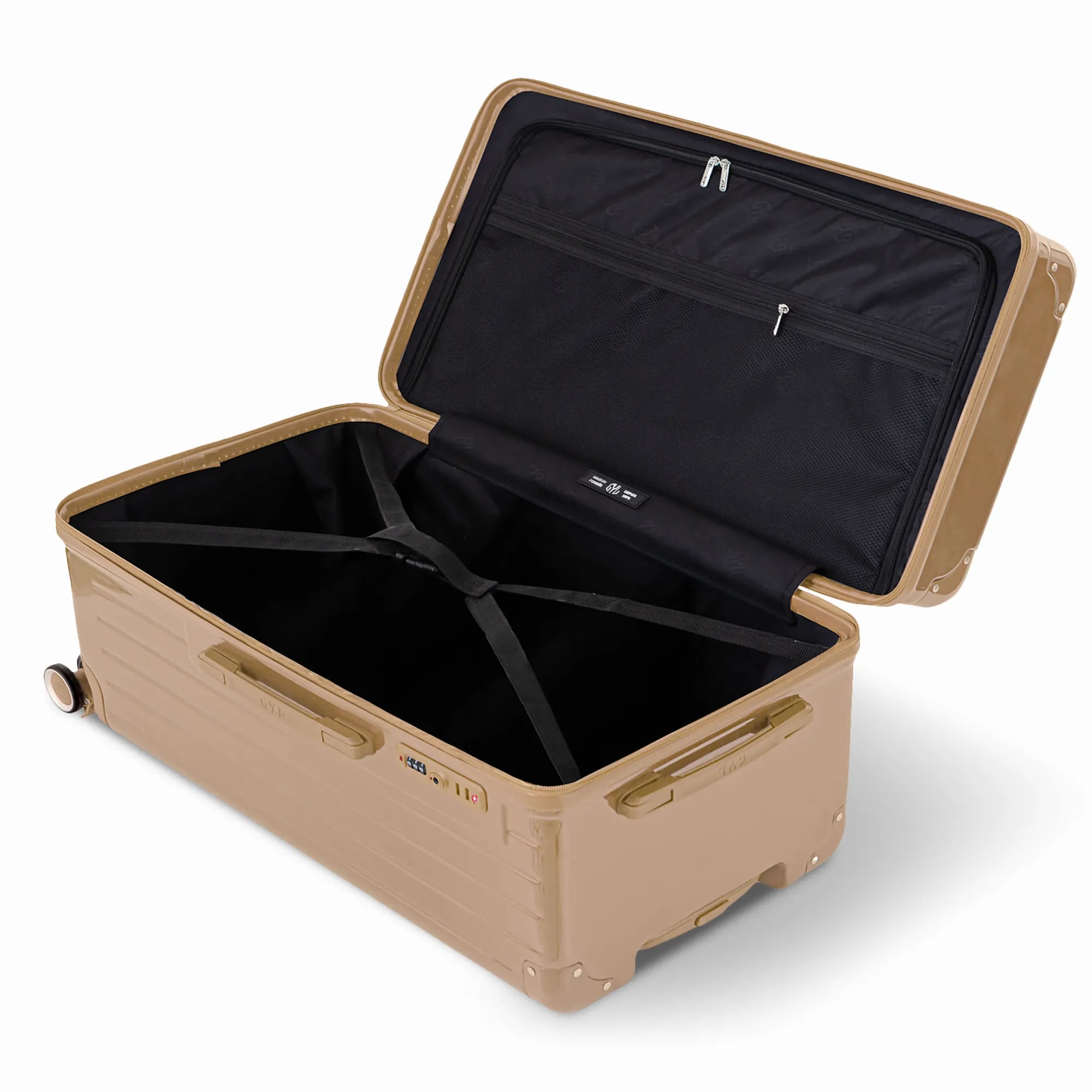Intérieur de la valise trunk GYL XL champagne ouvert, avec sangles croisées et compartiments de rangement.