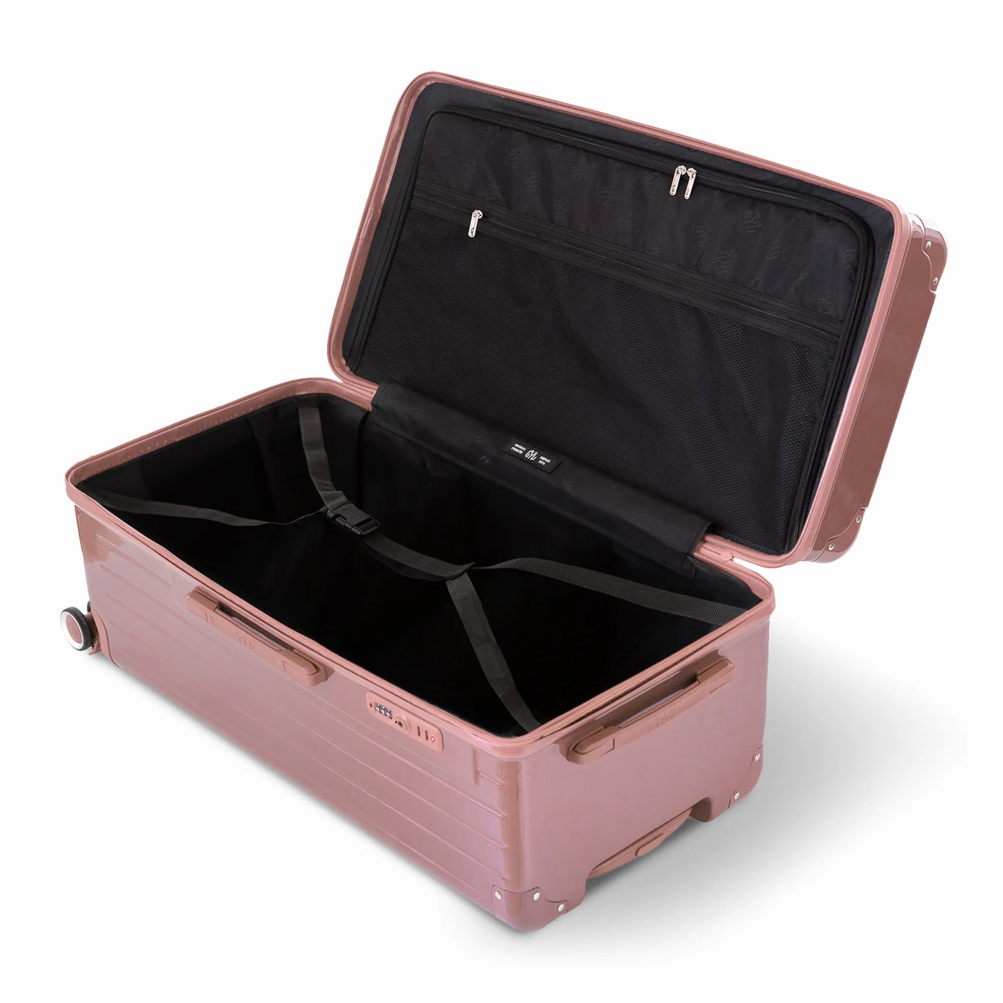 Intérieur de la valise trunk GYL XL rose gold ouvert, avec sangles croisées et compartiments de rangement.