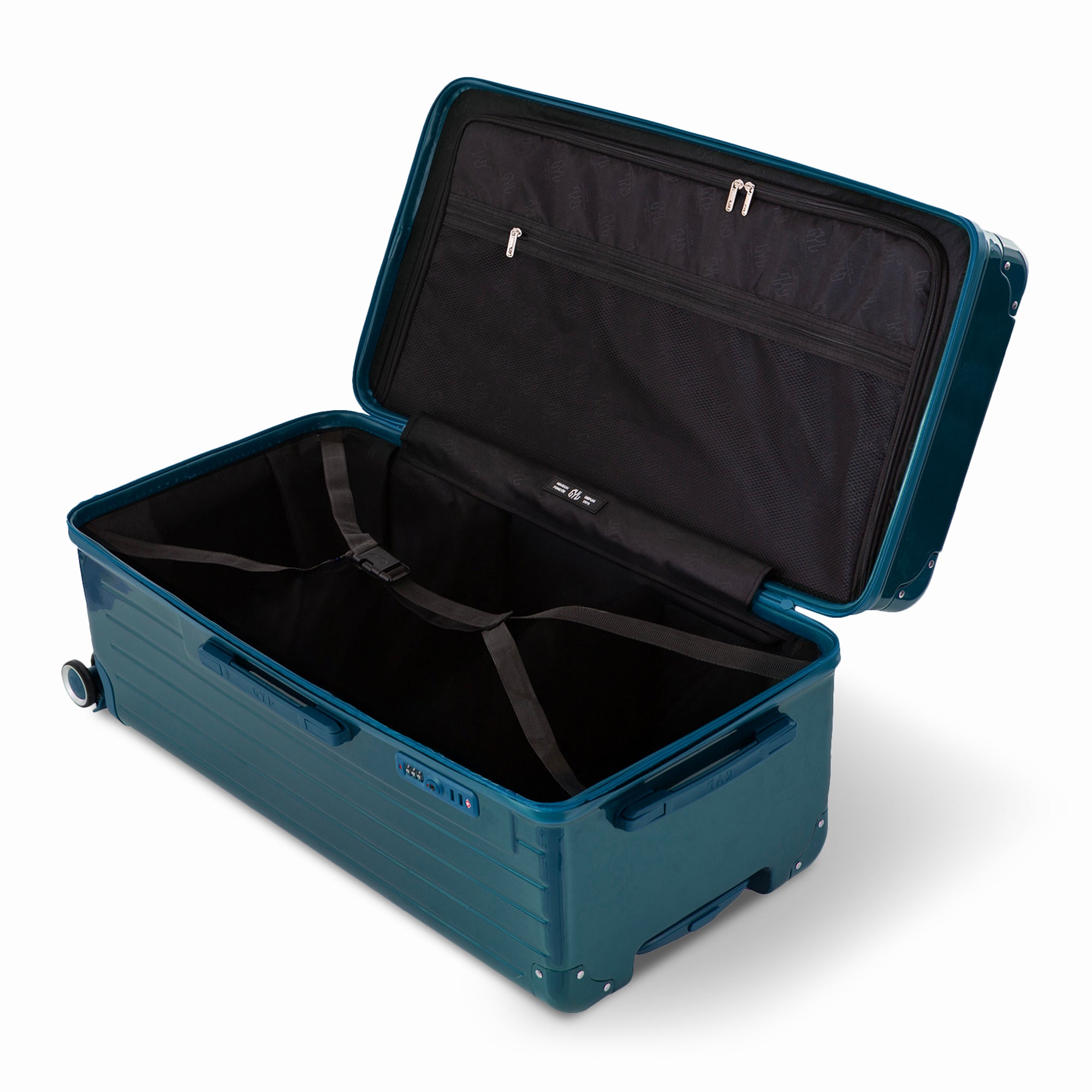 Intérieur de la valise trunk GYL XL sapin foncé ouvert, avec sangles croisées.