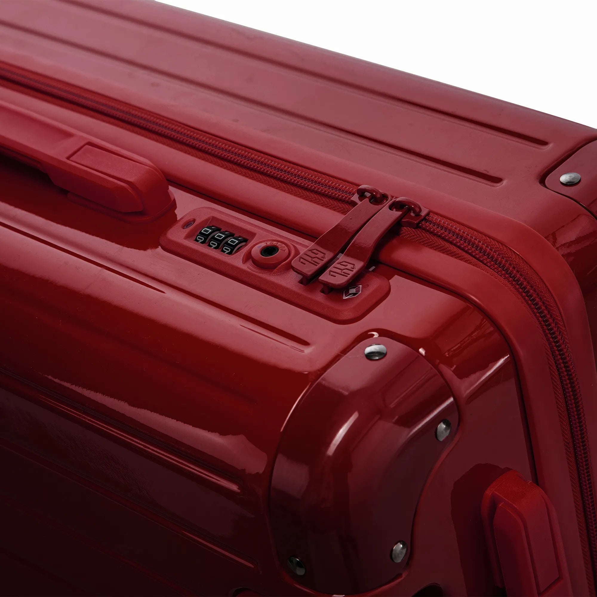 Fermeture à combinaison TSA et double curseur zippé GYL sur la valise rigide rouge foncé Intemporelle.