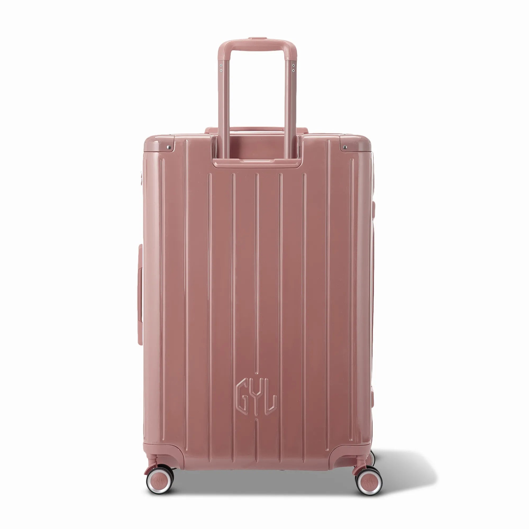 Vue arrière de la valise rigide GYL Intemporelle rose gold avec poignées intégrées et roulettes pivotantes.