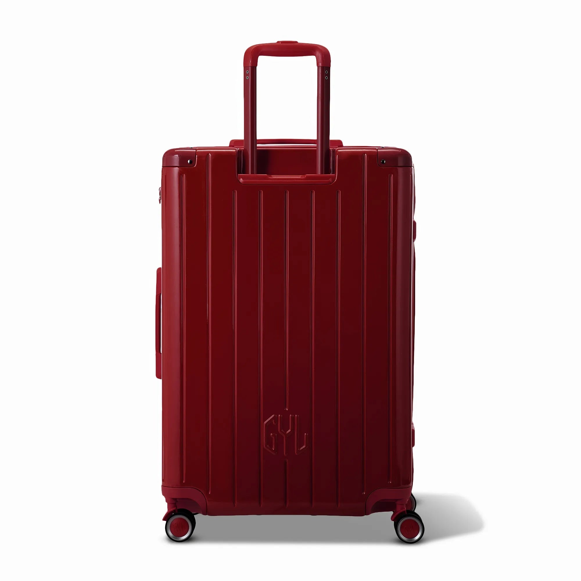 Vue arrière de la valise rigide GYL Intemporelle rouge foncé avec poignées intégrées et roulettes pivotantes.