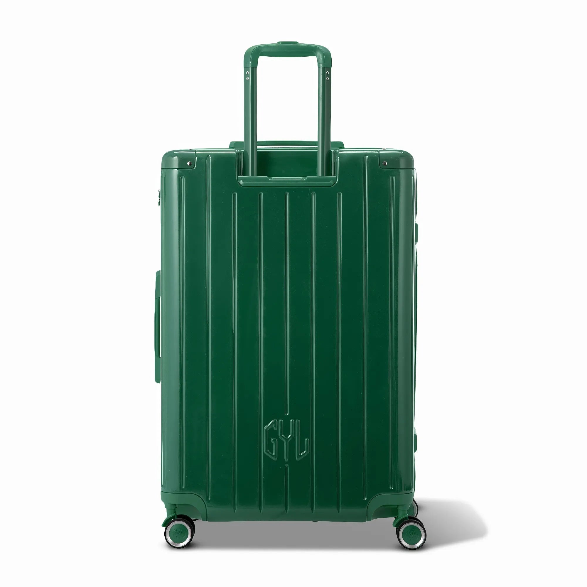 Vue arrière de la valise rigide GYL Intemporelle sapin avec poignées intégrées et roulettes pivotantes.