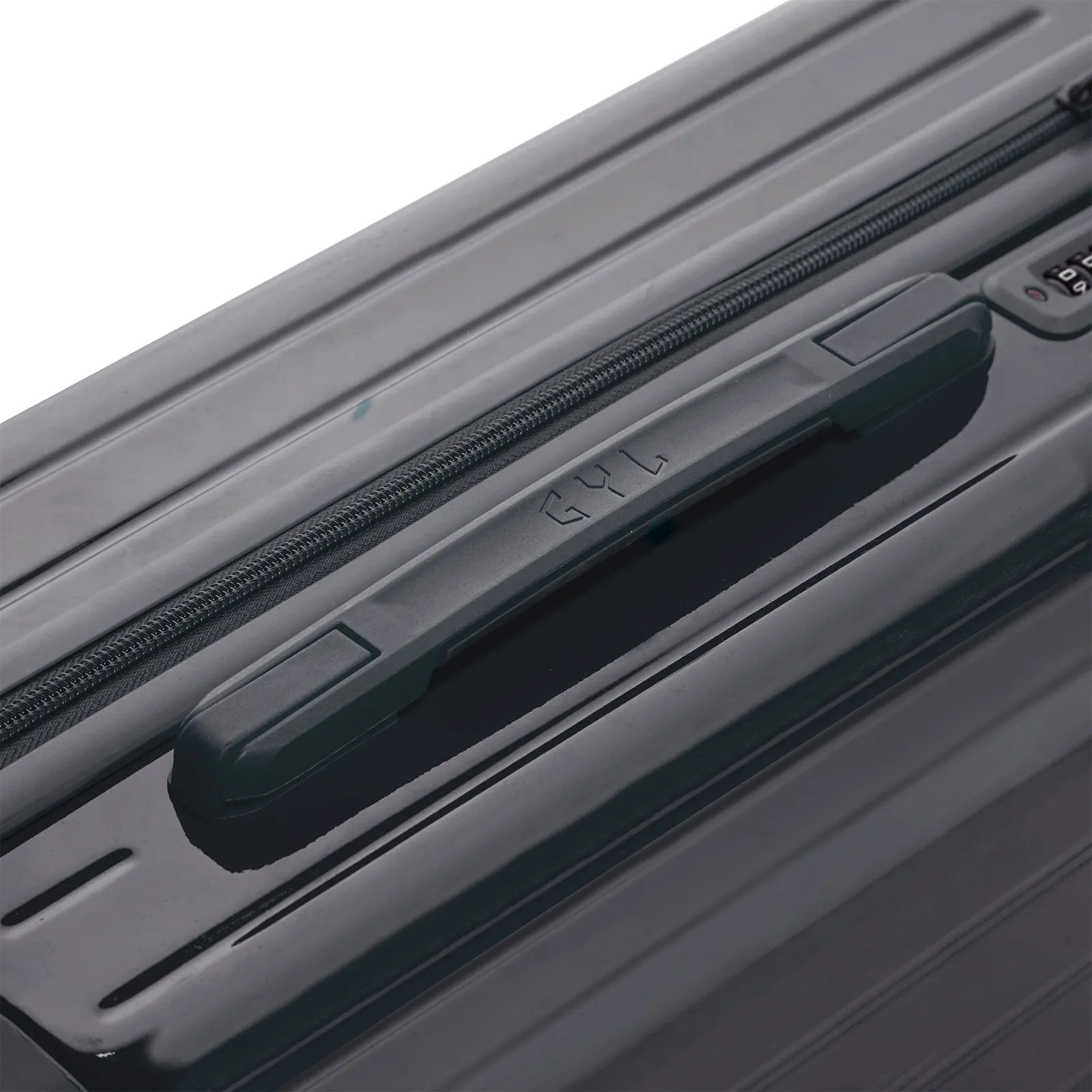 Poignée supérieure rigide de la valise GYL Intemporelle gris foncee avec logo embossé sur le dessus.