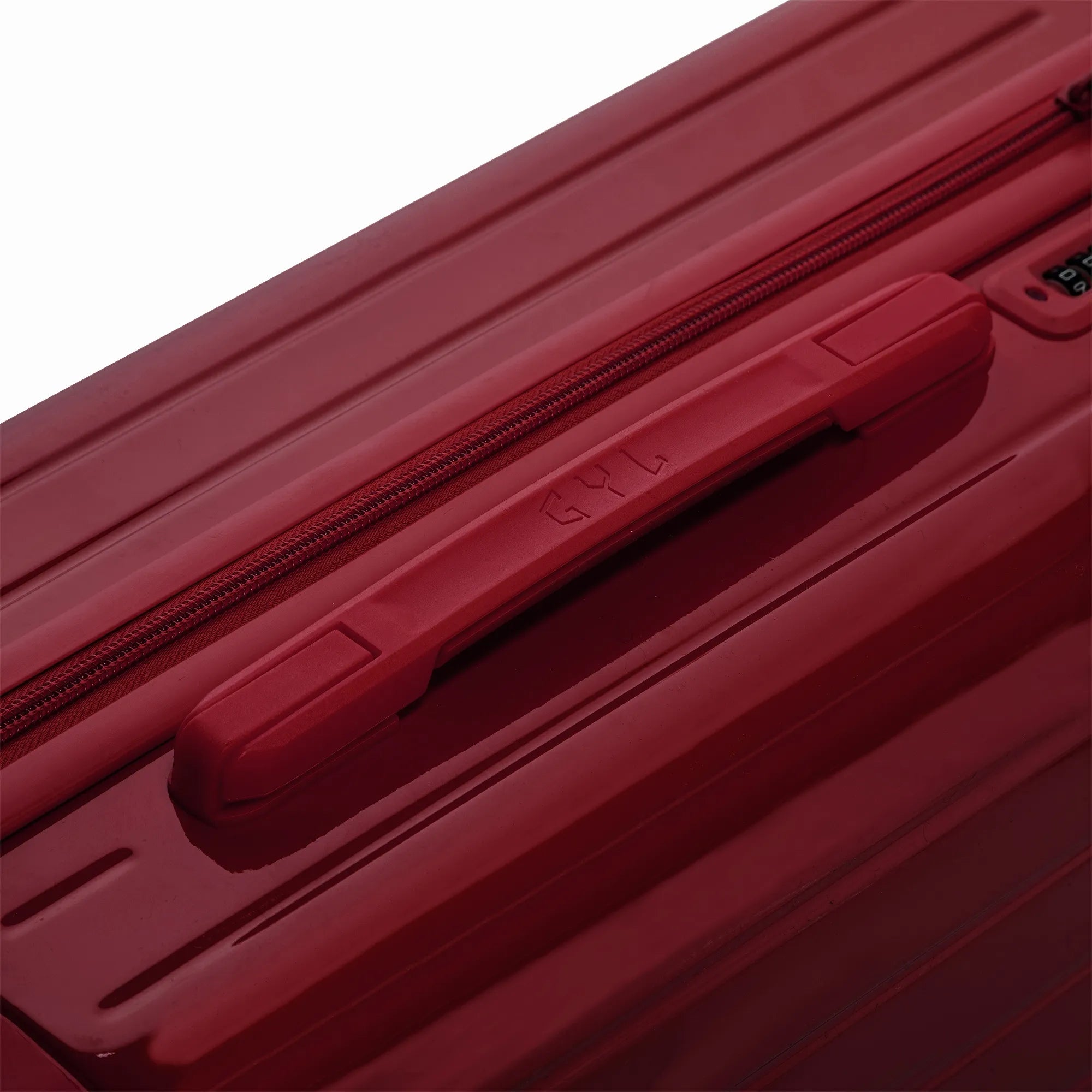 Poignée supérieure rigide de la valise GYL Intemporelle orange avec logo embossé sur le dessus.