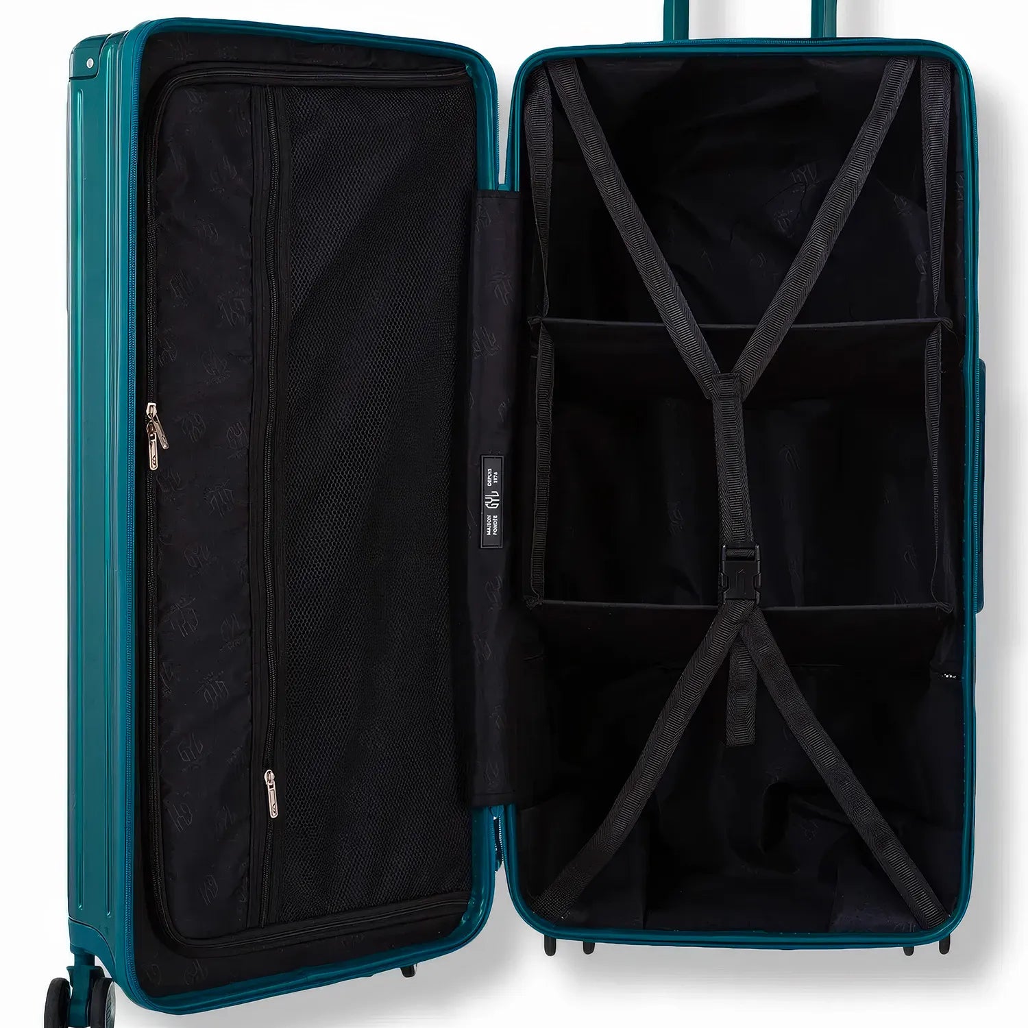 Intérieur de la valise Trunk GYL avec deux séparateurs et sangles croisées pour une organisation optimale.