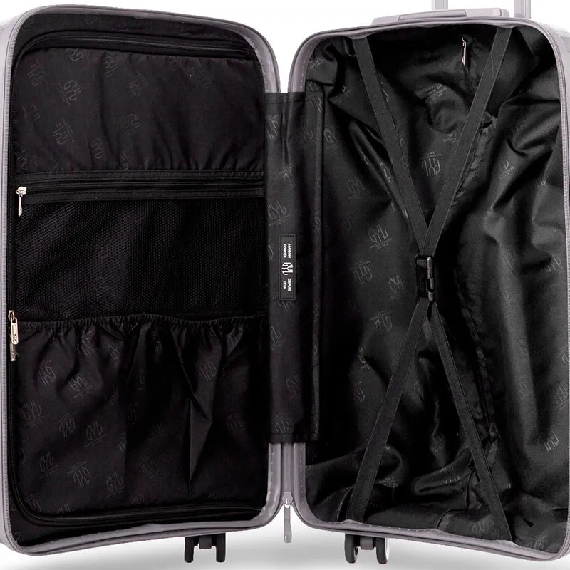 Intérieur de la valise Signature GYL avec sangles croisées et poches de rangement pratiques