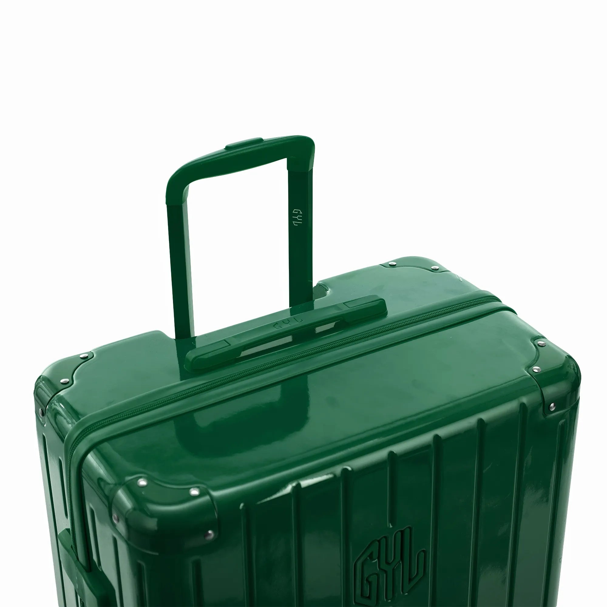 Poignée trolley télescopique GYL déployée sur la valise Intemporelle sapin en polycarbonate.