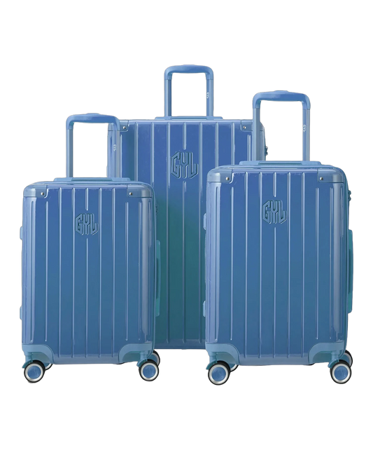 Set de 3 valises rigides Intemporelle en polycarbonate coloris bleu grise vue de face avec logo GYL