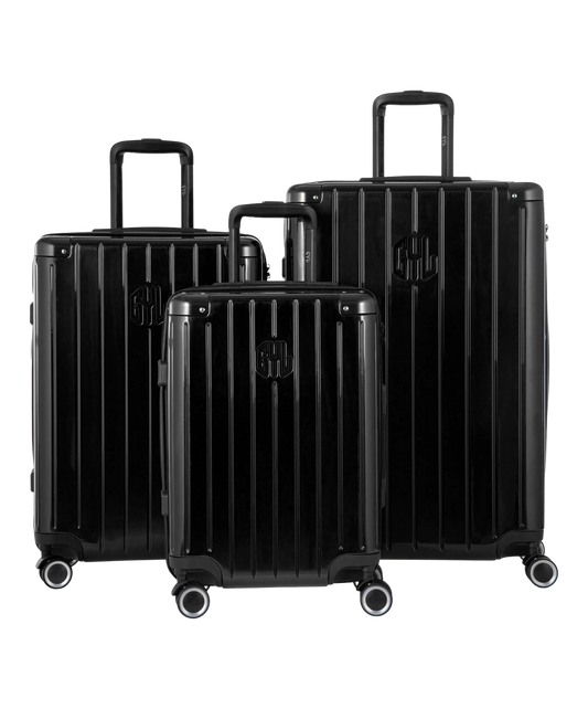 Valise Intemporelle en polycarbonate set de 3 valises cabine semaine et soute coloris noire vue de face du set complet