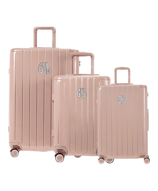 Trio de valises rigides GYL Intemporelle nude avec coques nervurées et poignées télescopiques. #couleur_nude