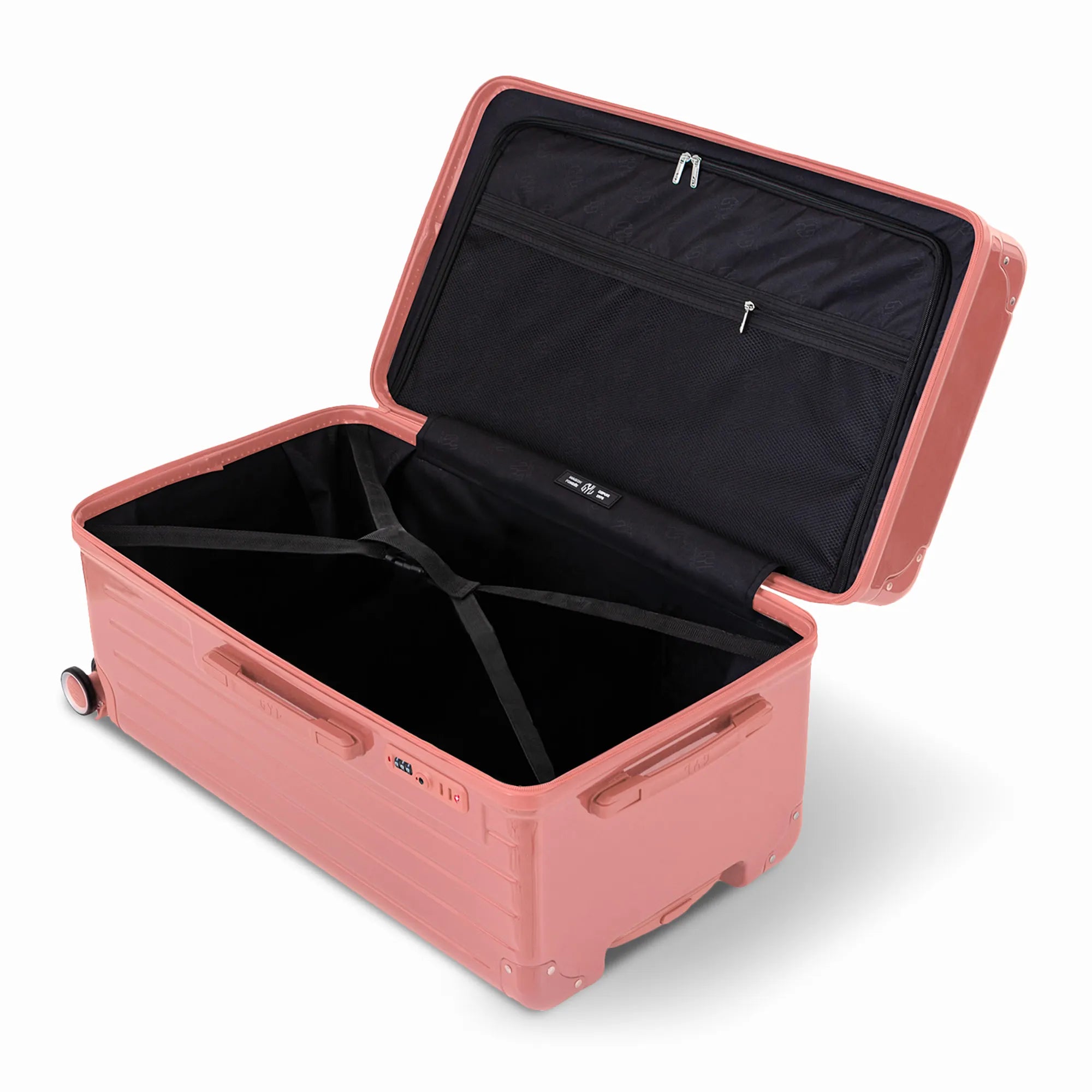 Intérieur de la valise trunk GYL L rose gold ouvert, avec sangles croisées.