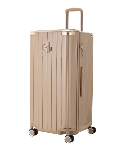 Valise Trunk XL Intemporelle GYL en polycarbonate 78 cm coloris champagne vue trois quarts avant