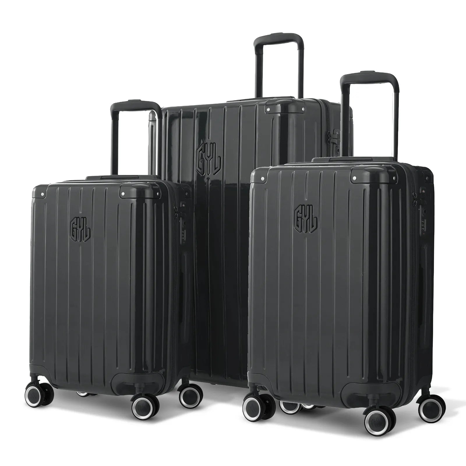 Trio de valises rigides GYL Intemporelle gris foncé avec coques nervurées et poignées télescopiques.